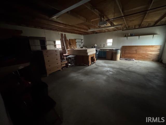 Basement featuring a garage and a workshop area