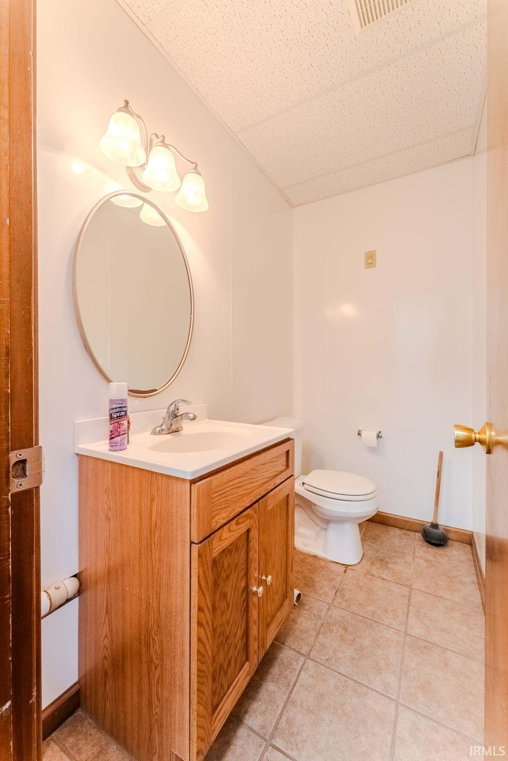 Bathroom featuring vanity and light tile patterned floors