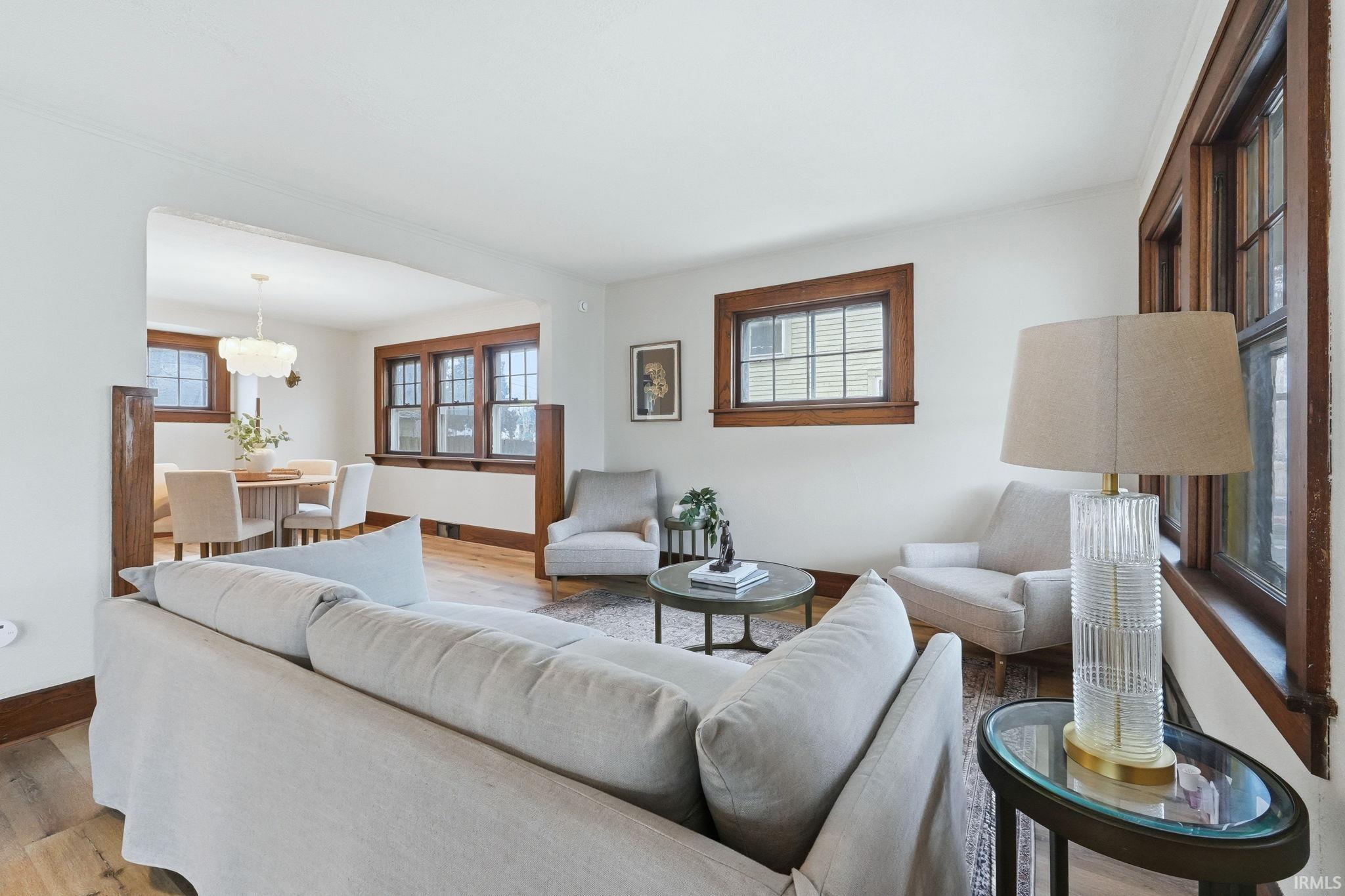 Living area with wood finished floors and baseboards
