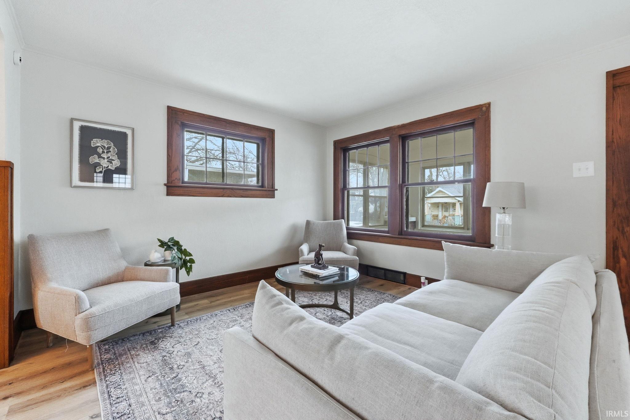 Living room featuring wood finished floors and baseboards