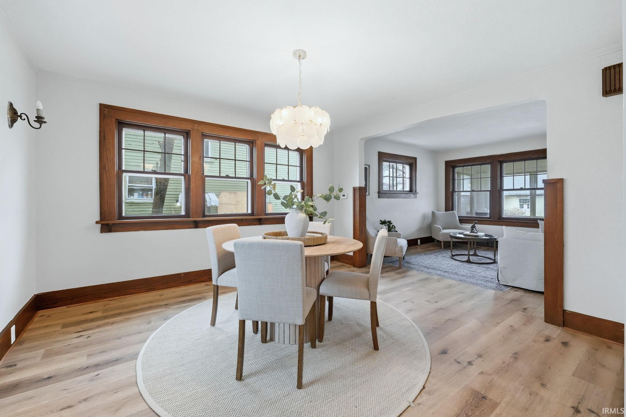 Dining space featuring a chandelier and light wood finished floors