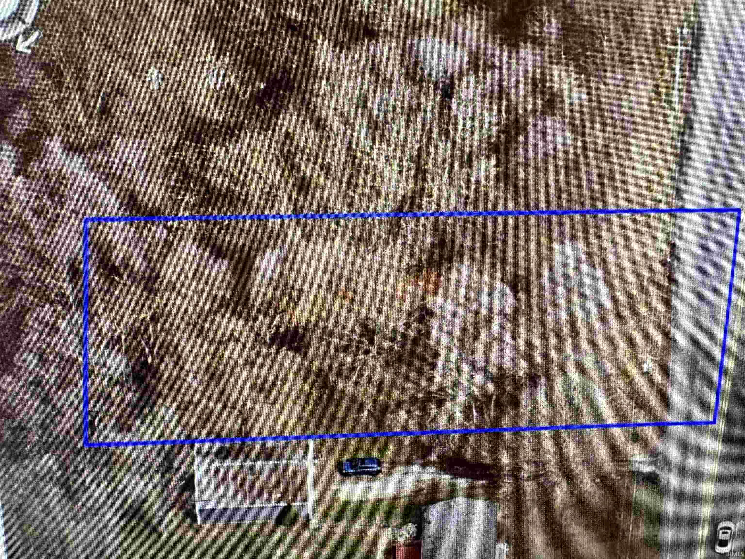 Aerial overview of property's location with property parcel outlined