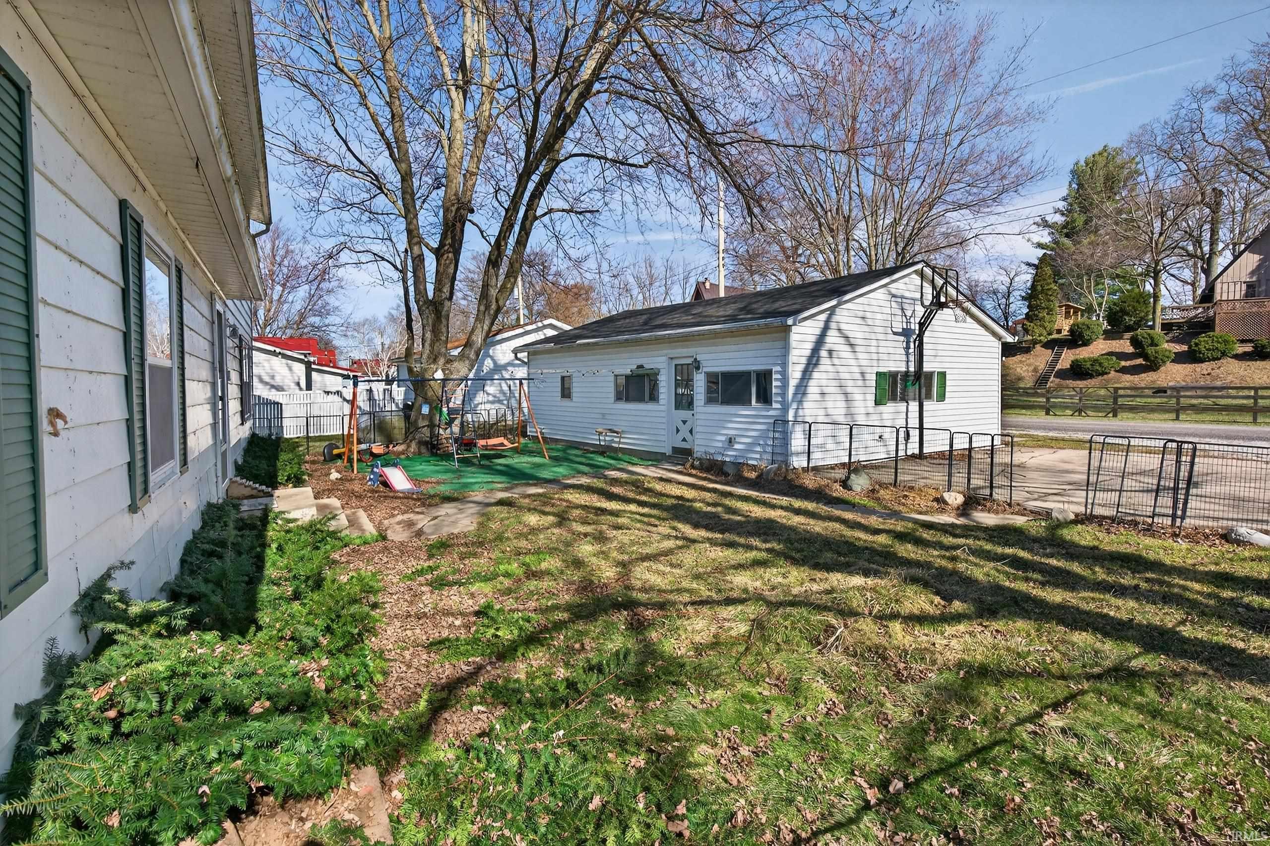 Fenced backyard with a patio