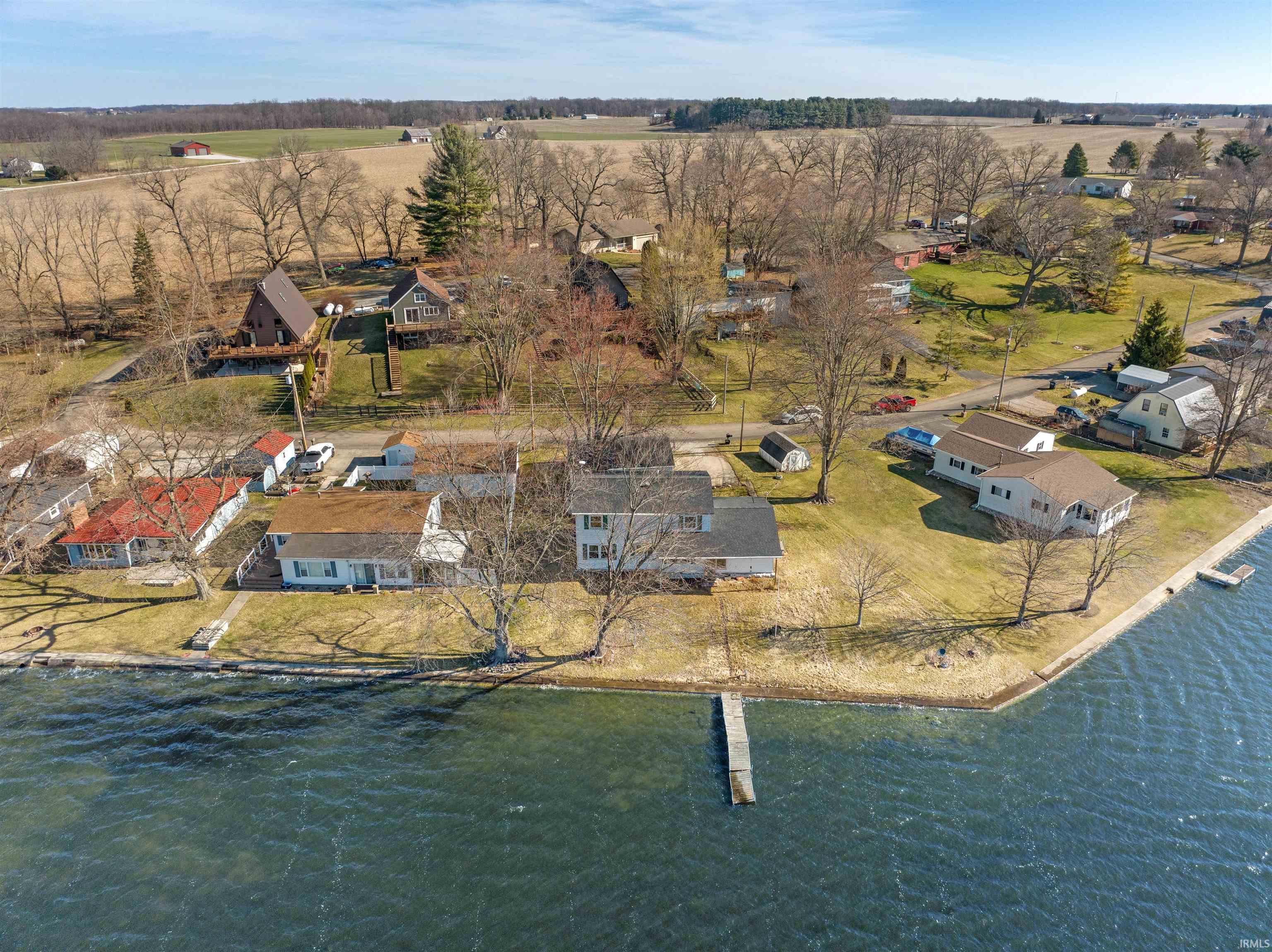 Aerial view of residential area featuring a large body of water