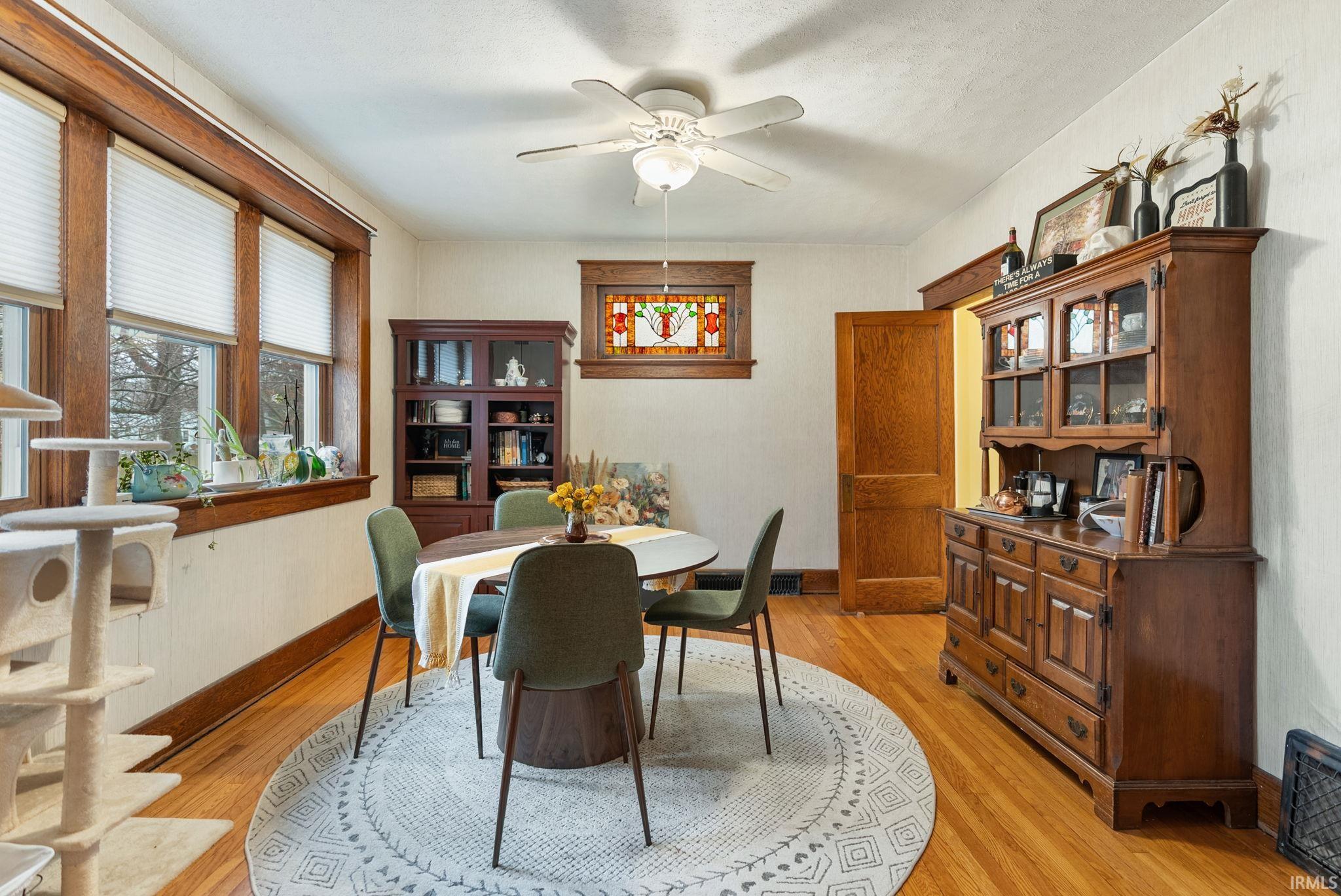 Dining room featuring ceiling fan and light wood-style floors