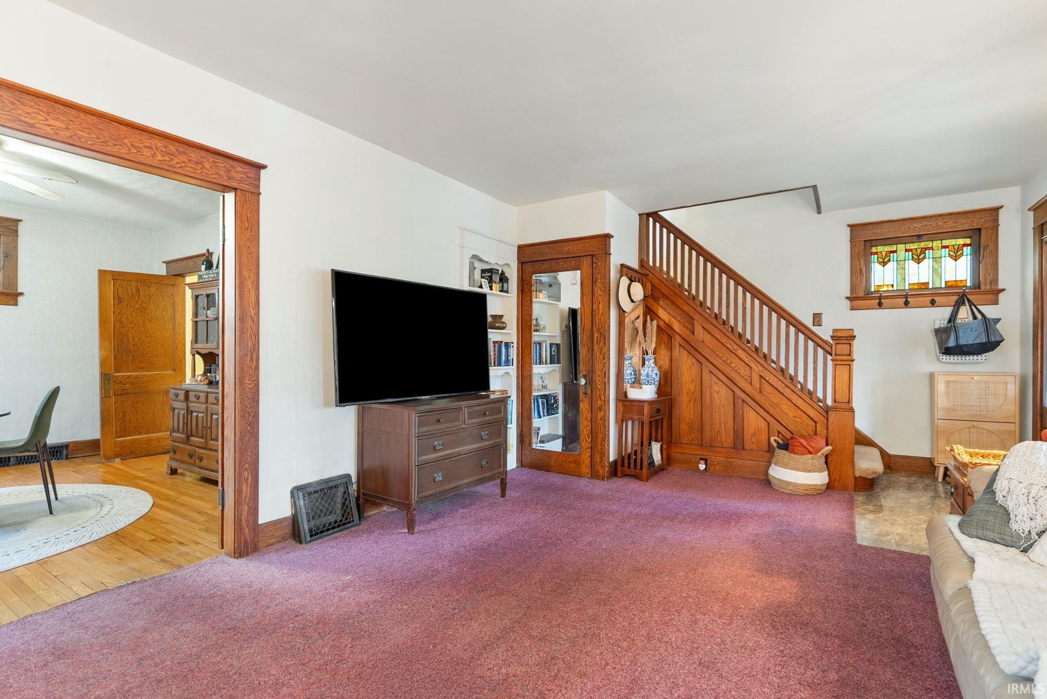Living area with light carpet