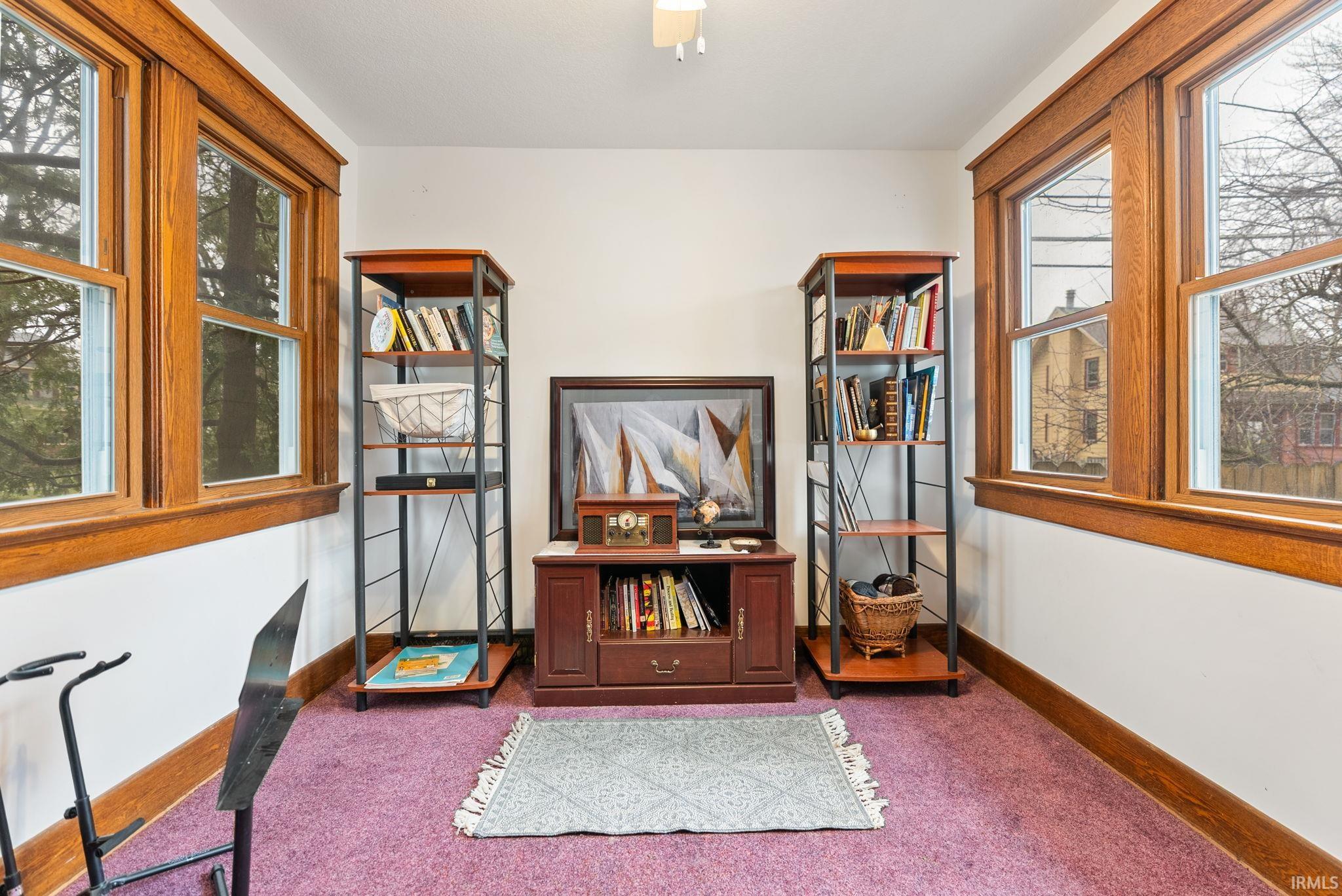 Office space with baseboards and carpet floors