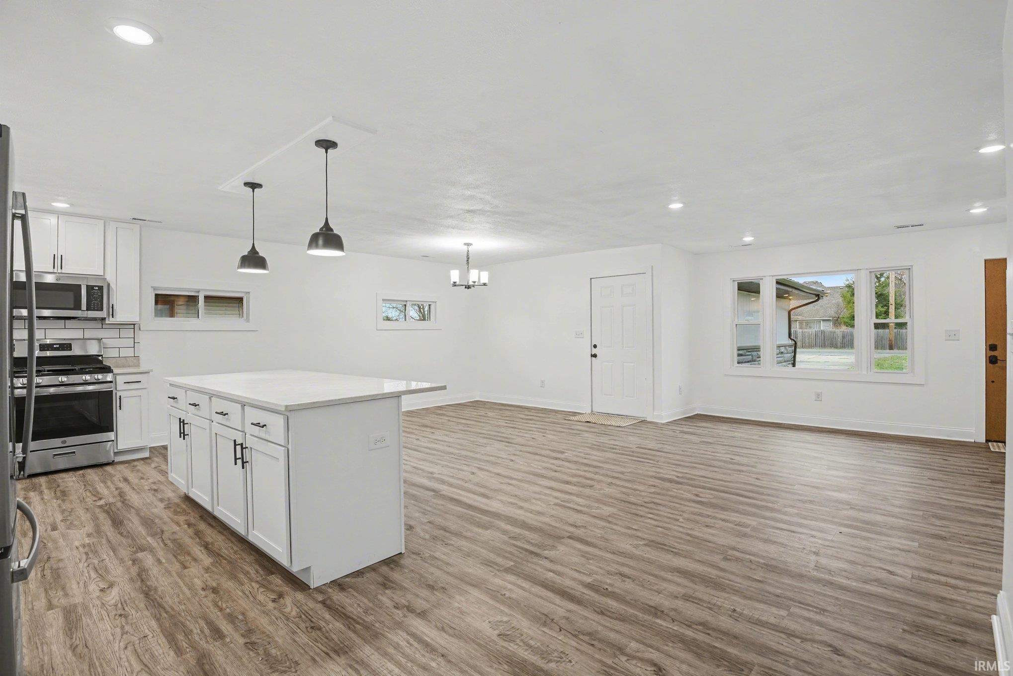 open floor plan, light wood finished floors