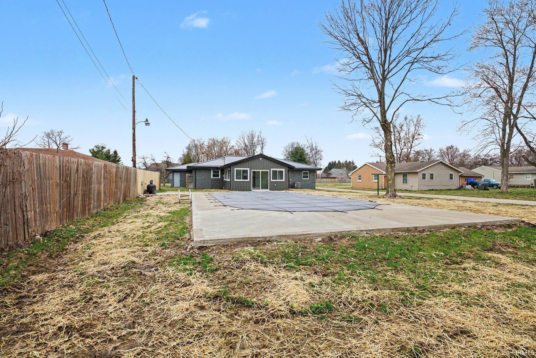 Rear view of house featuring a patio