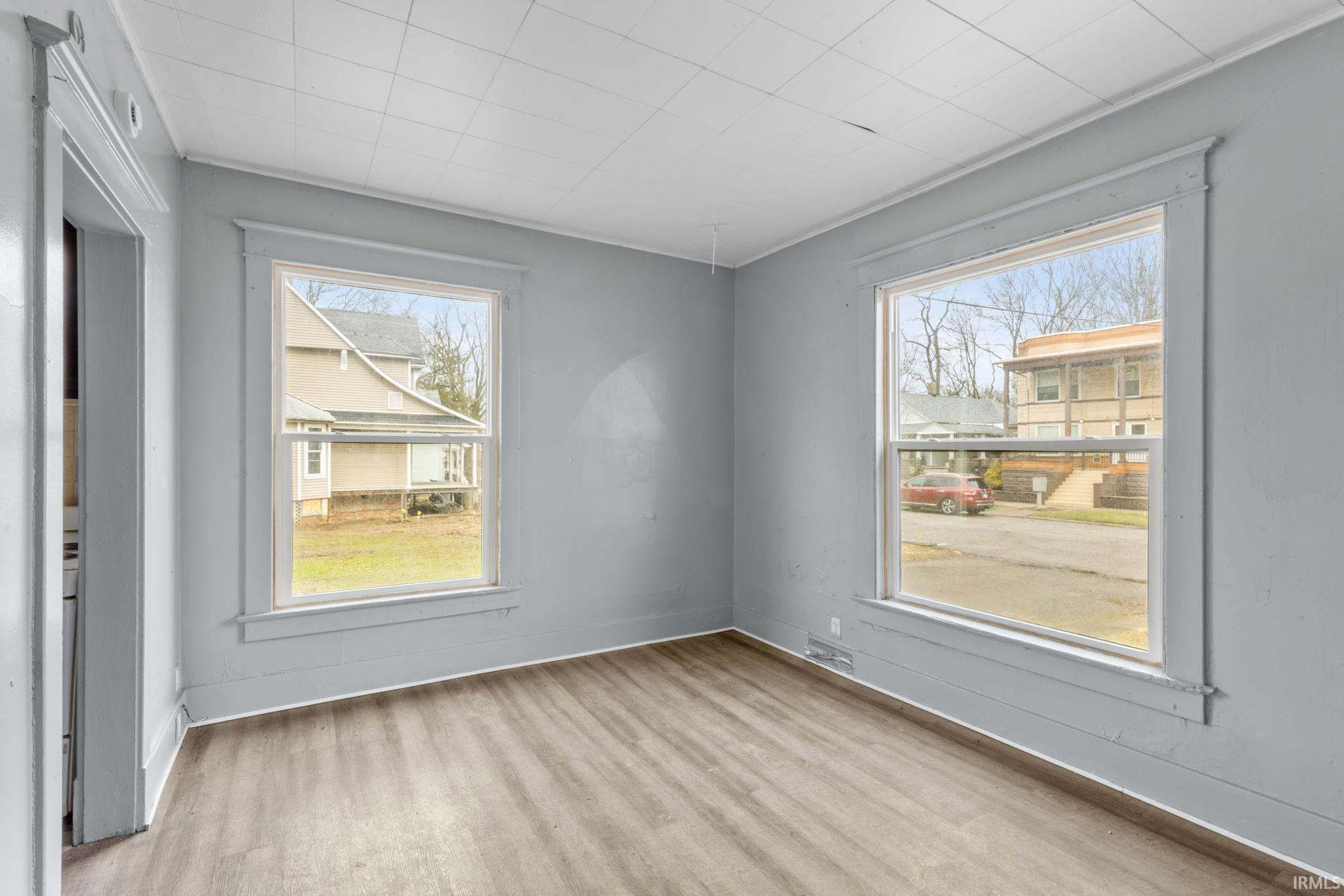 Spare room with light wood-type flooring and plenty of natural light