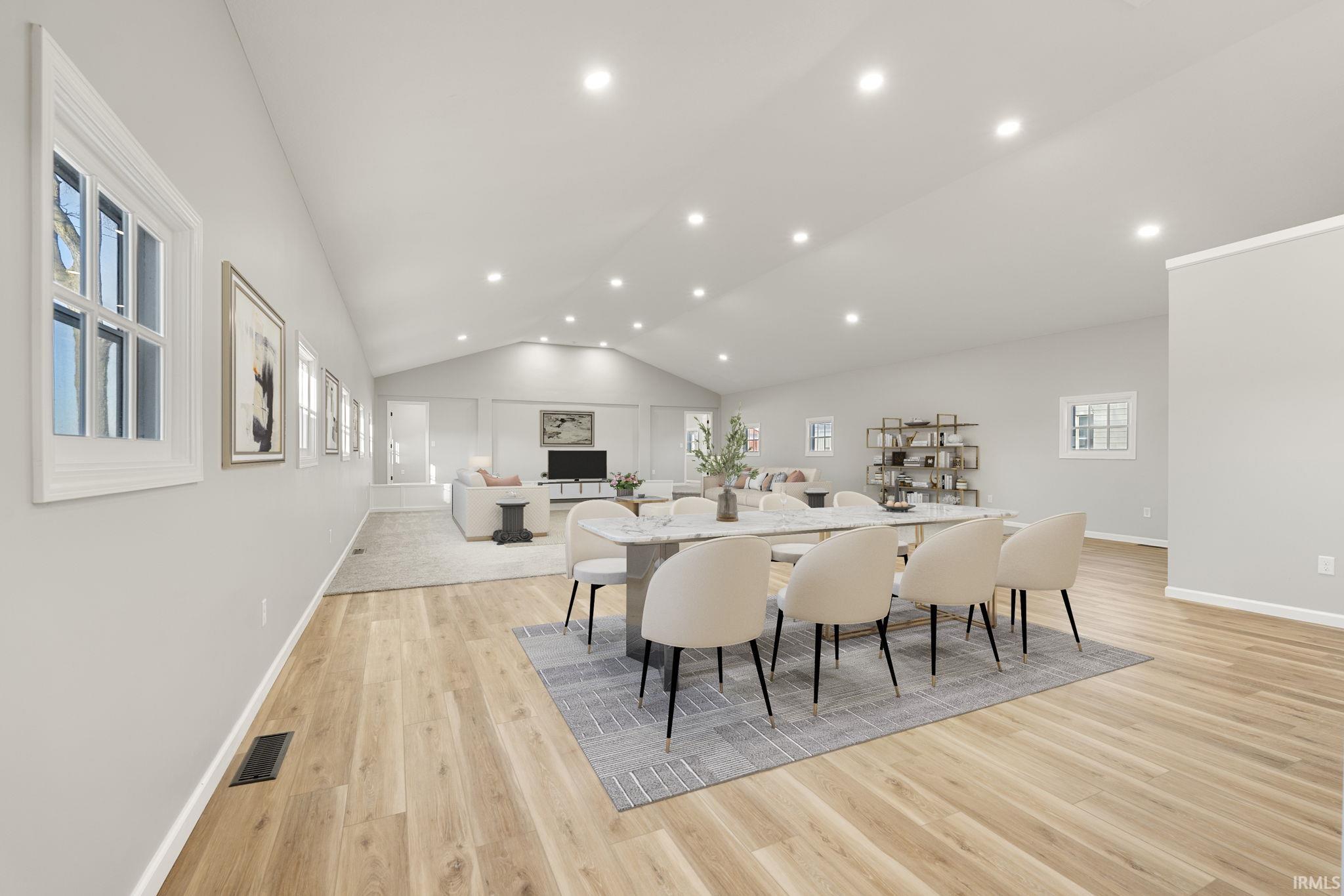 Virtually staged dining area in front of living room space
