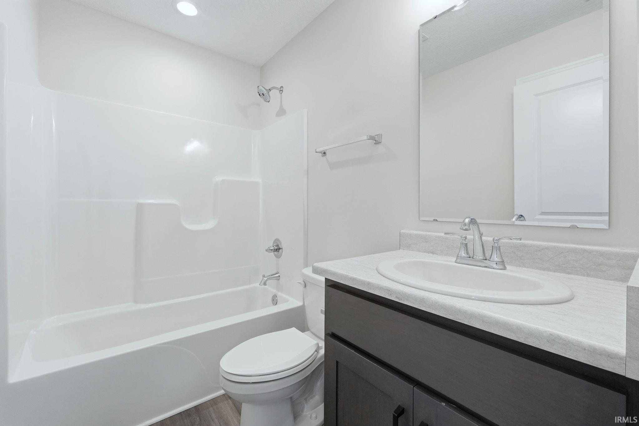 Bathroom with vanity and shower / tub combination