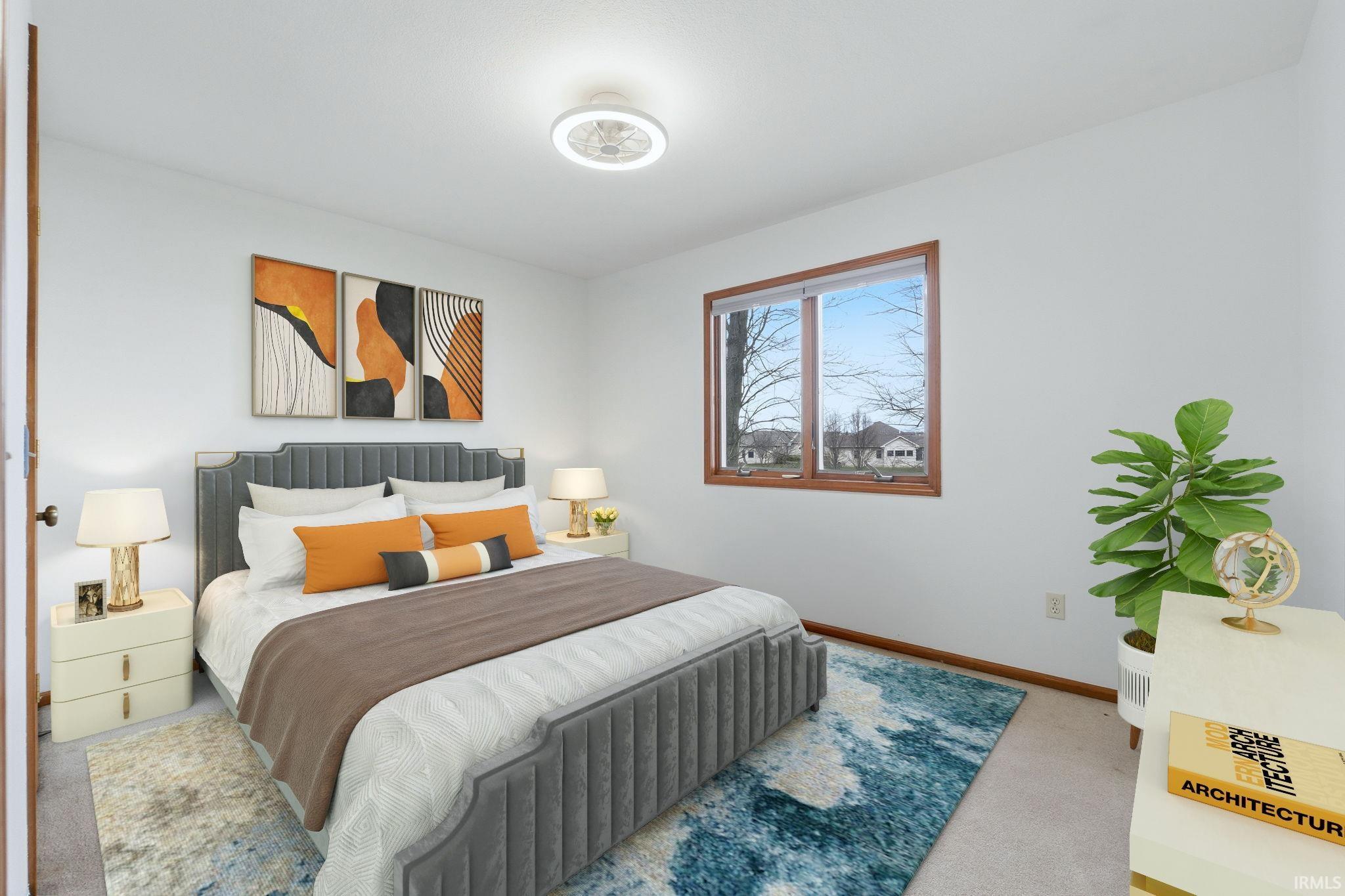 Carpeted bedroom featuring baseboards