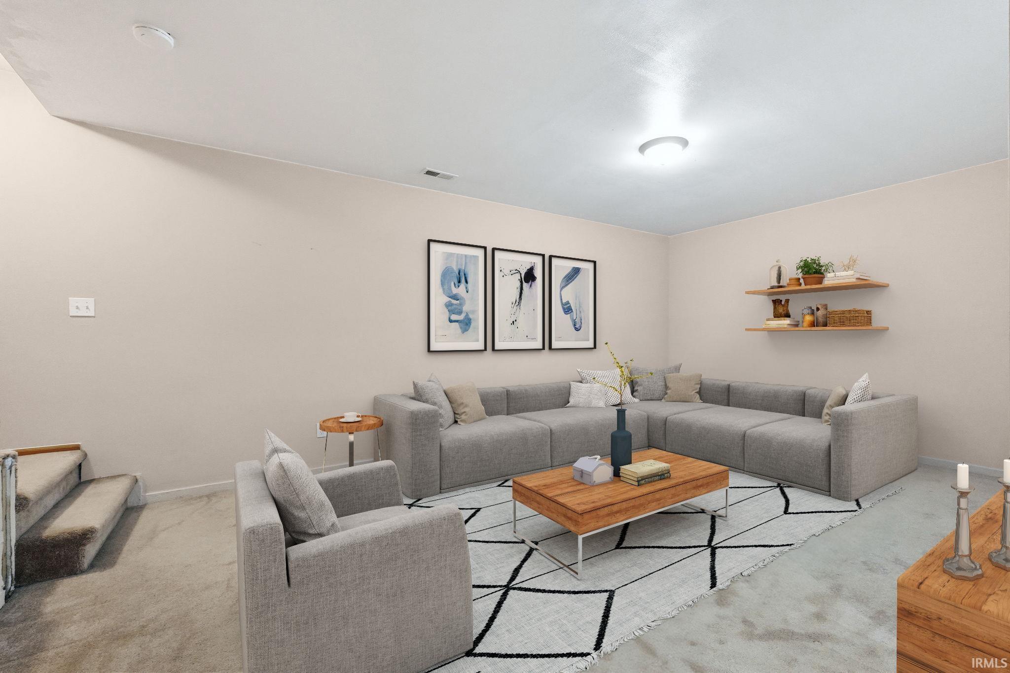 Carpeted living area with baseboards