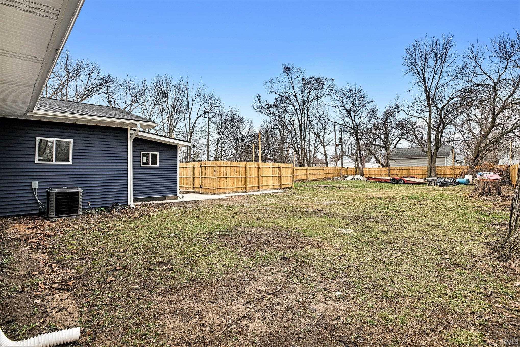 View of fenced backyard