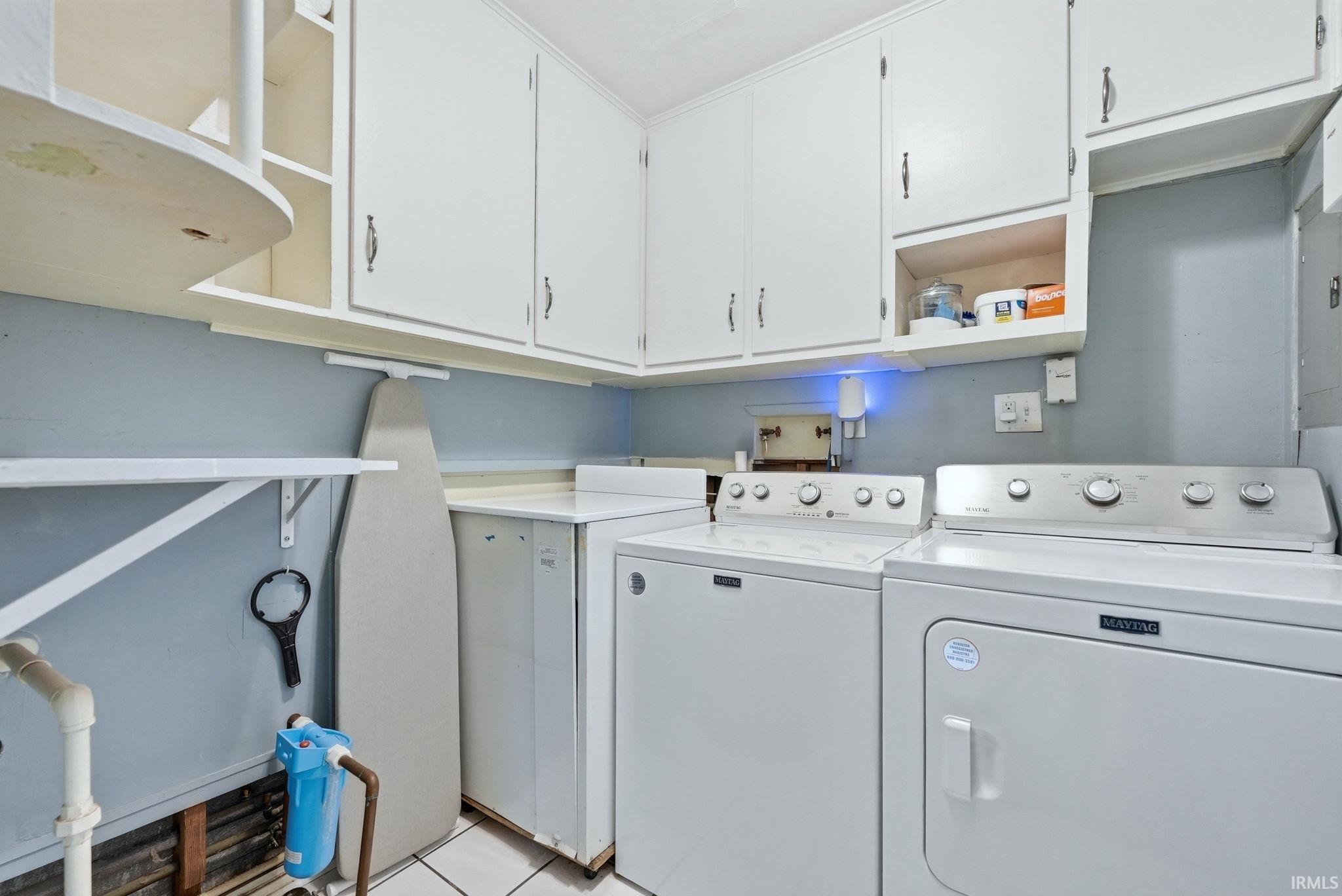 Laundry room featuring cabinet space and washer and dryer