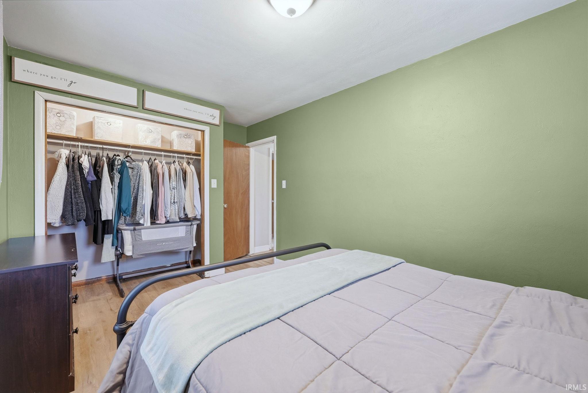 Bedroom featuring a closet and wood finished floors