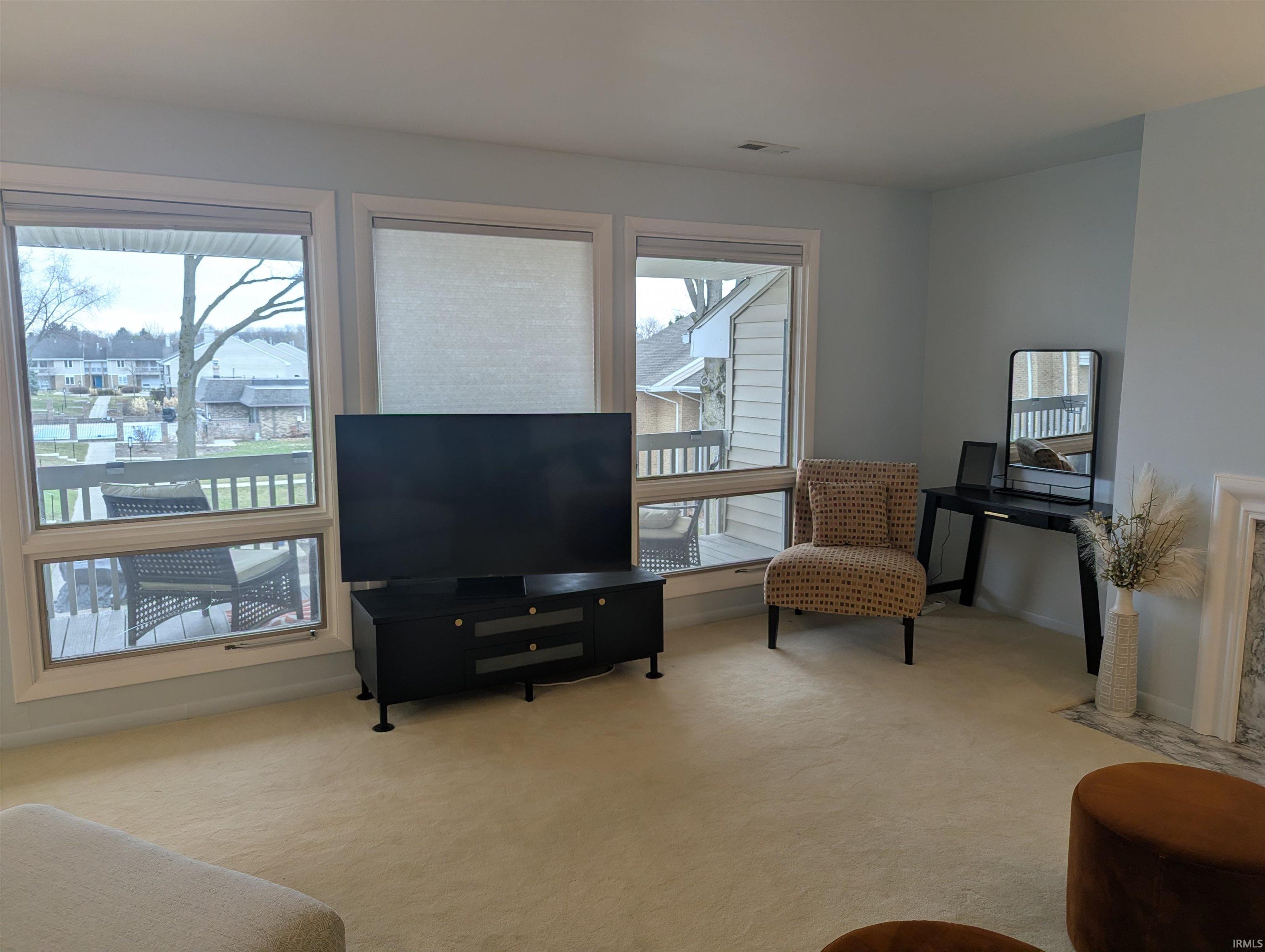 Sitting room with light carpet