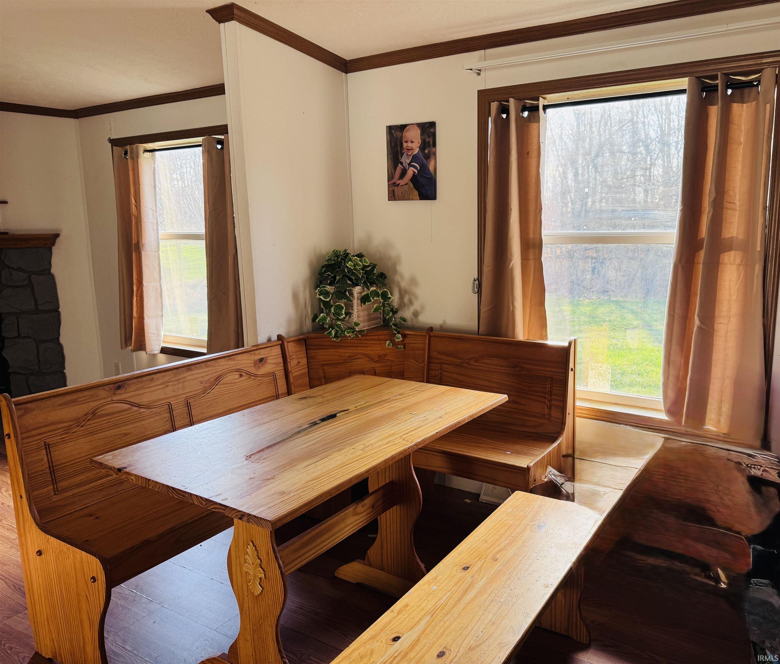 Dining space featuring ornamental molding