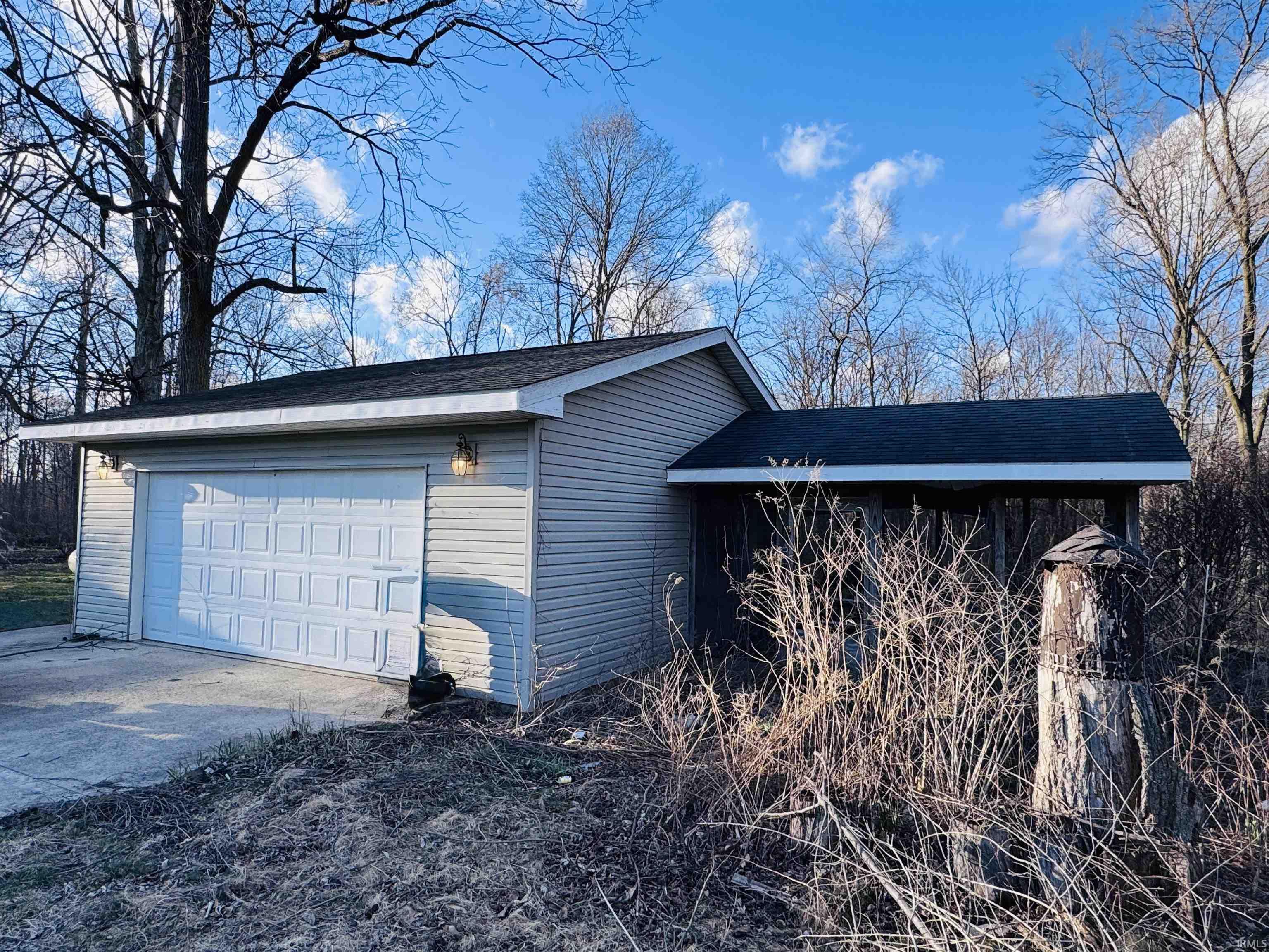 Garage with concrete driveway