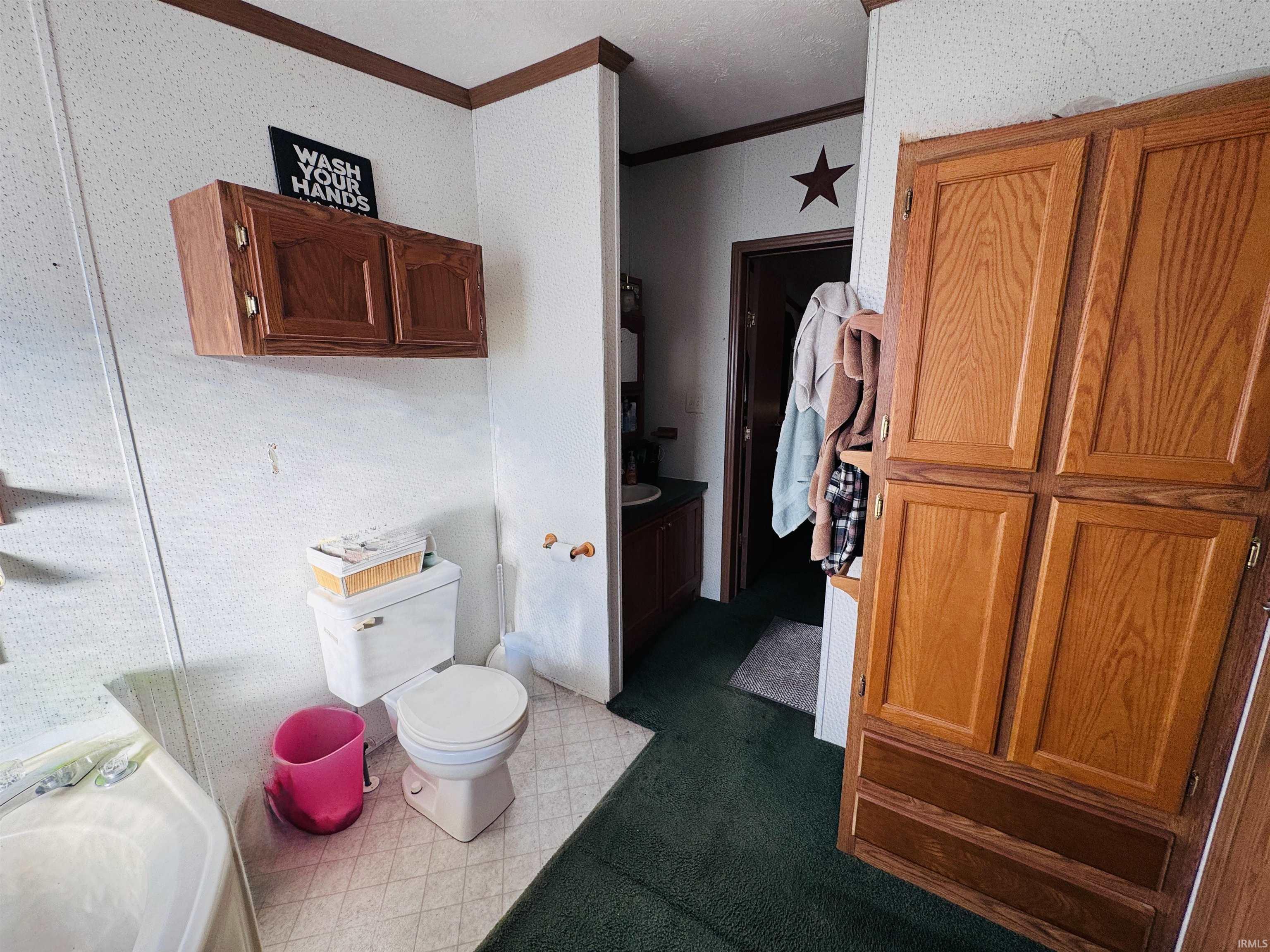 Bathroom with light flooring and vanity