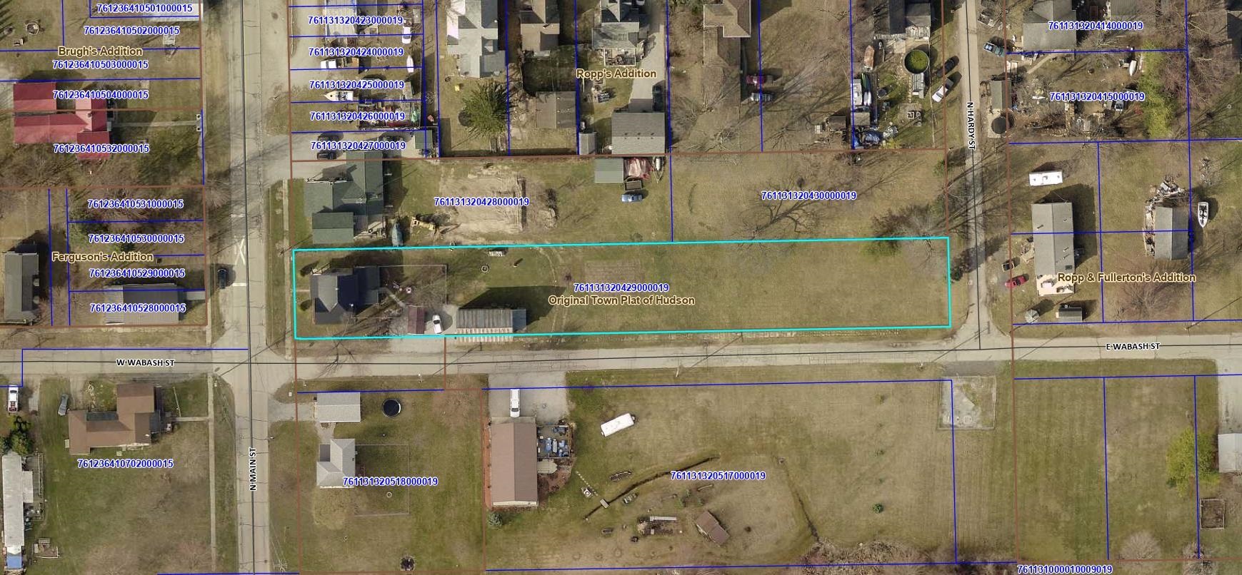 Aerial overview of property's location with property parcel outlined