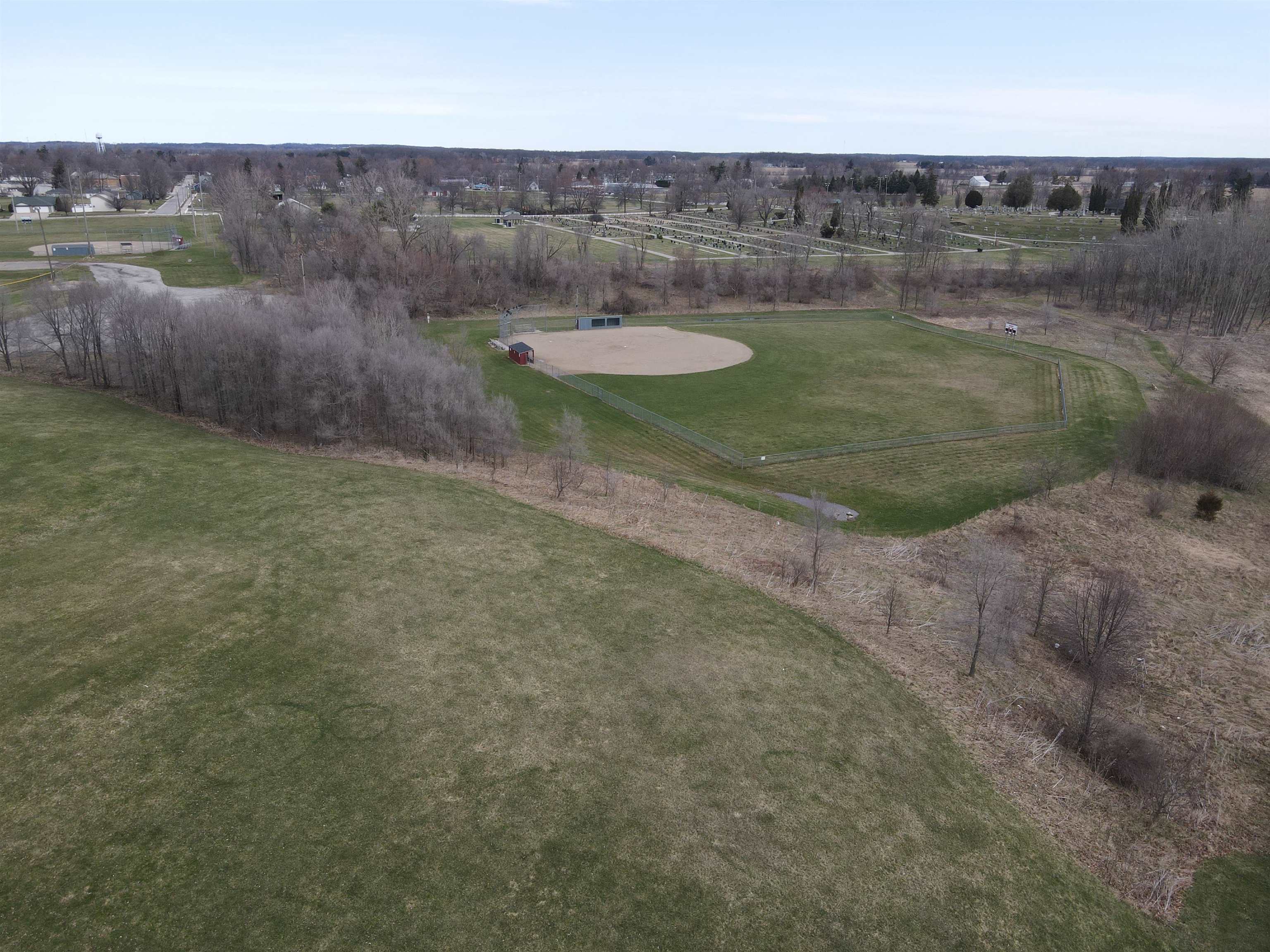 Aerial view of property and surrounding area featuring rural landscape
