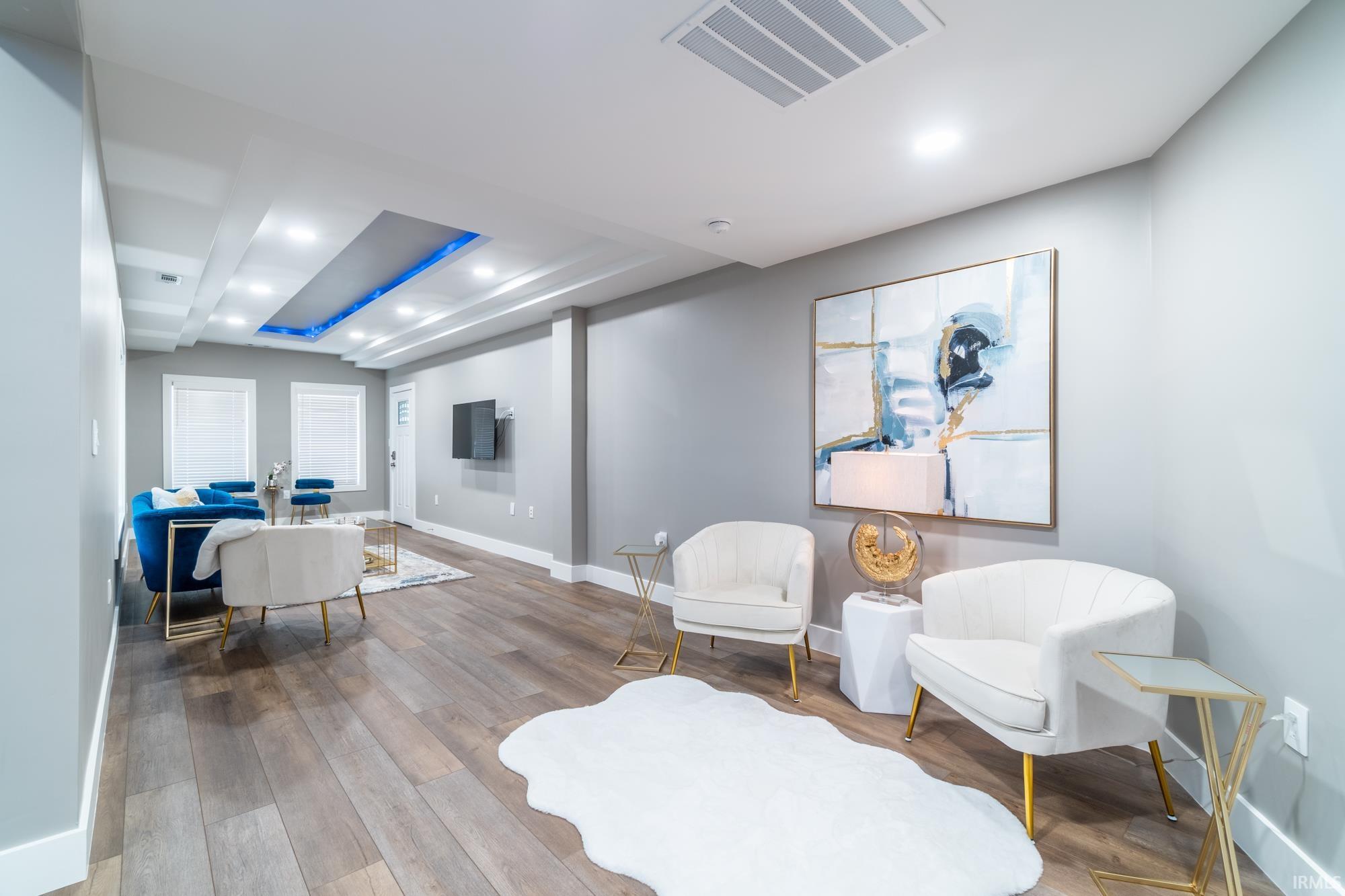 Sitting room featuring recessed lighting and hardwood / wood-style flooring