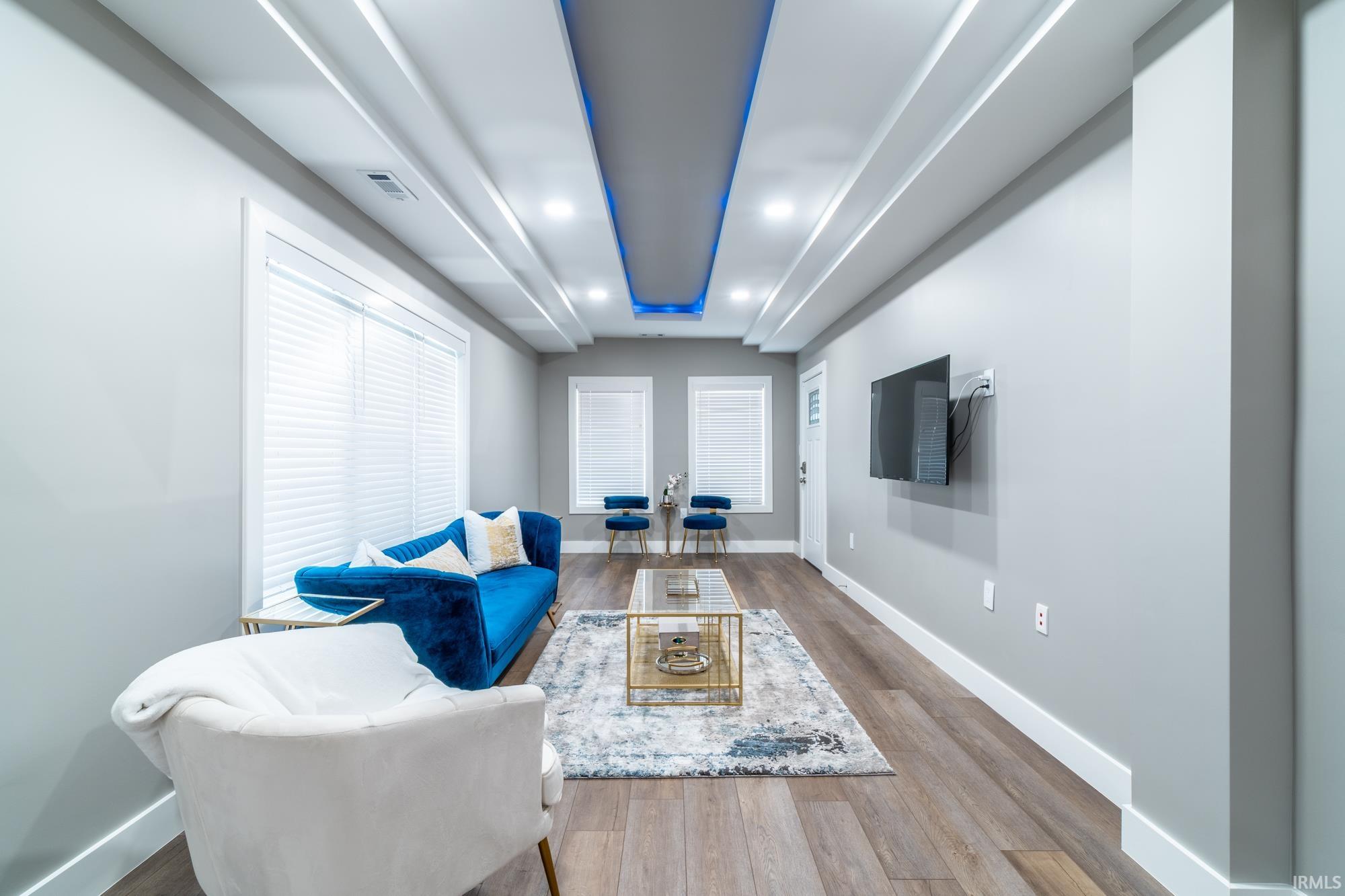 Sitting room with recessed lighting and wood finished floors