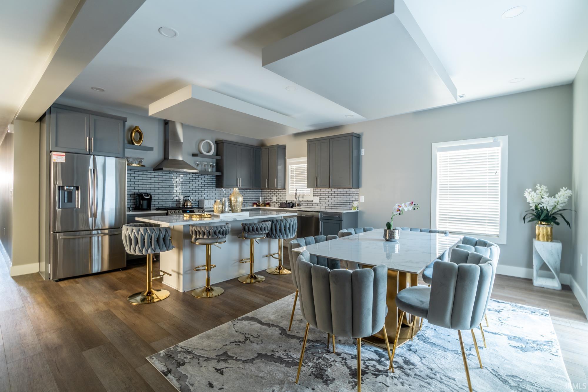 Dining area featuring baseboards and dark wood-type flooring