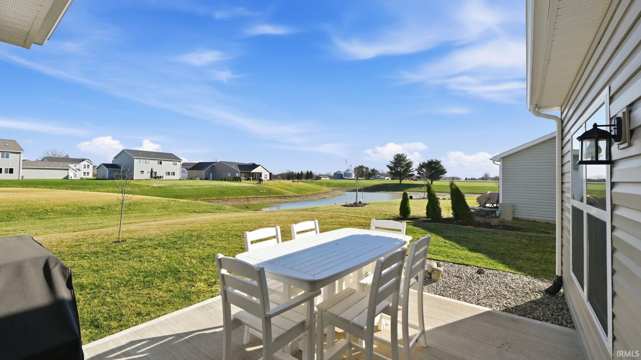 View of patio / terrace with a water view, area for grilling, and outdoor dining area