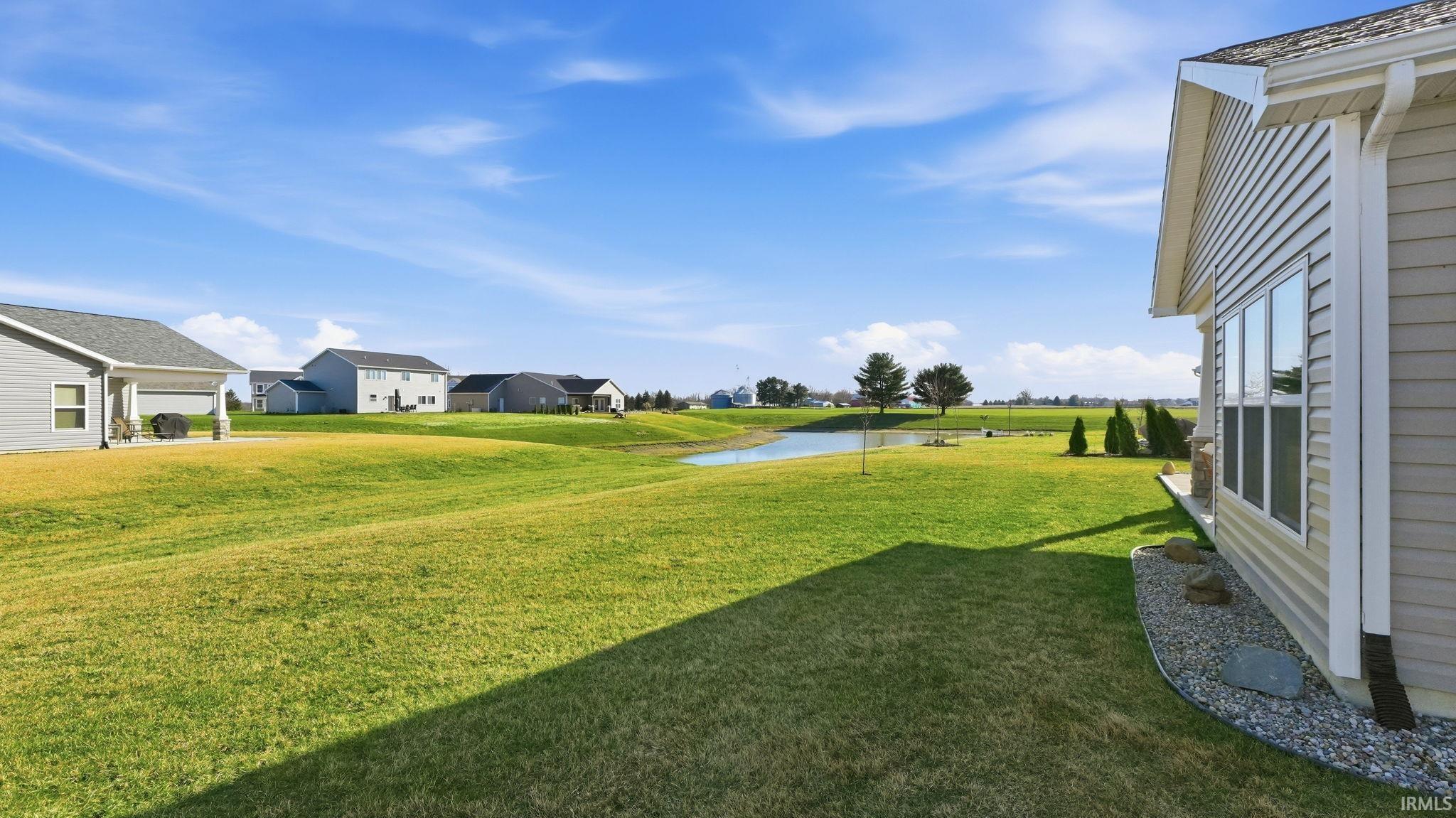 View of grassy yard featuring a water view