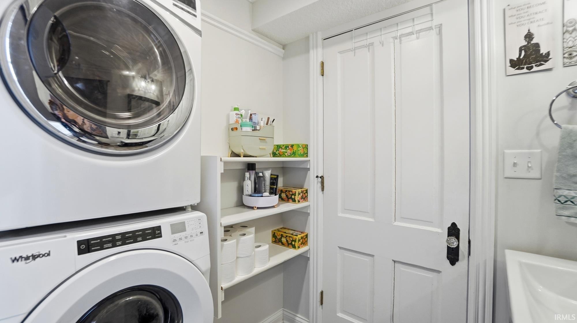 Laundry area with stacked washer / drying machine