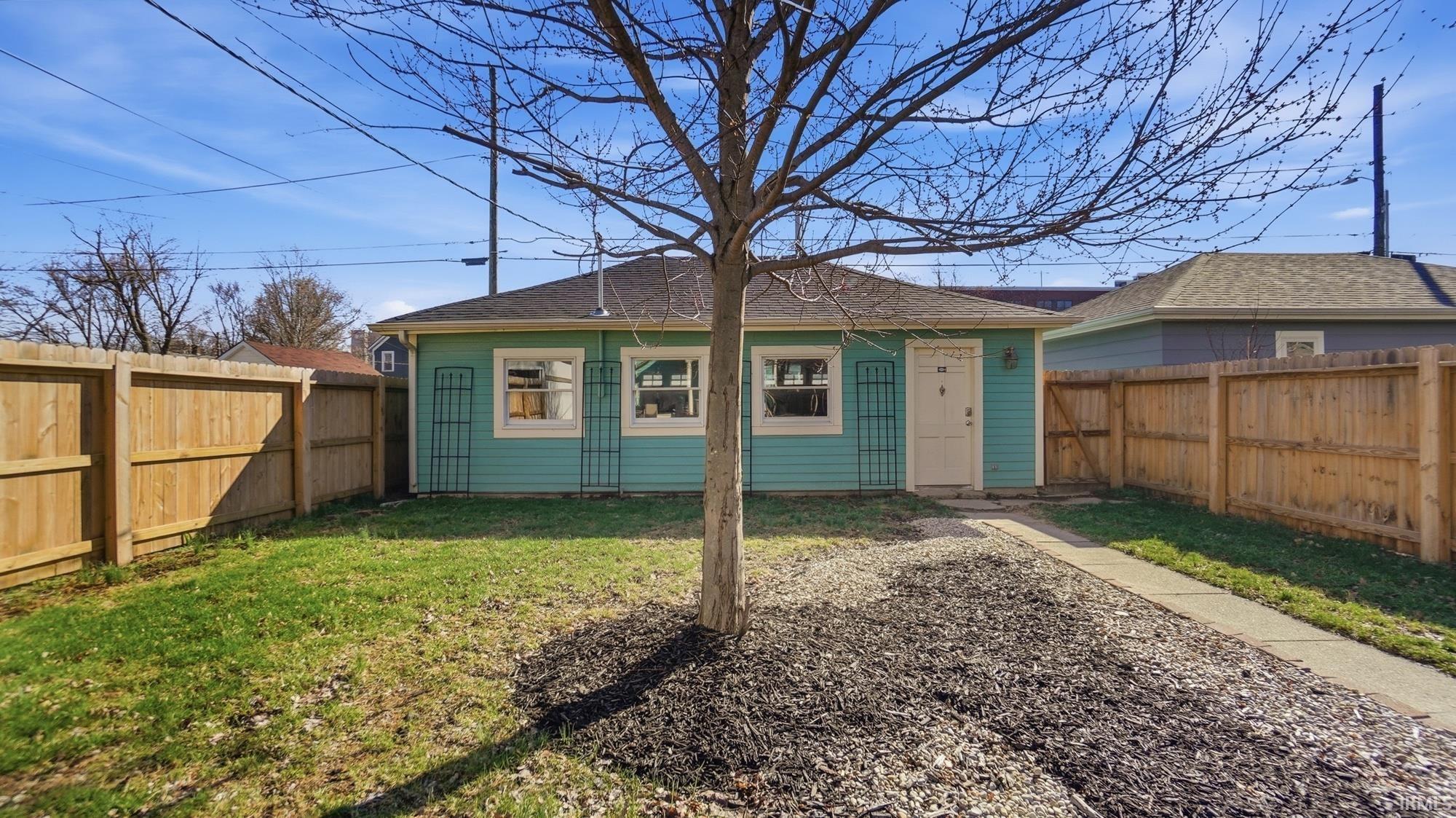 View of outbuilding with a fenced backyard