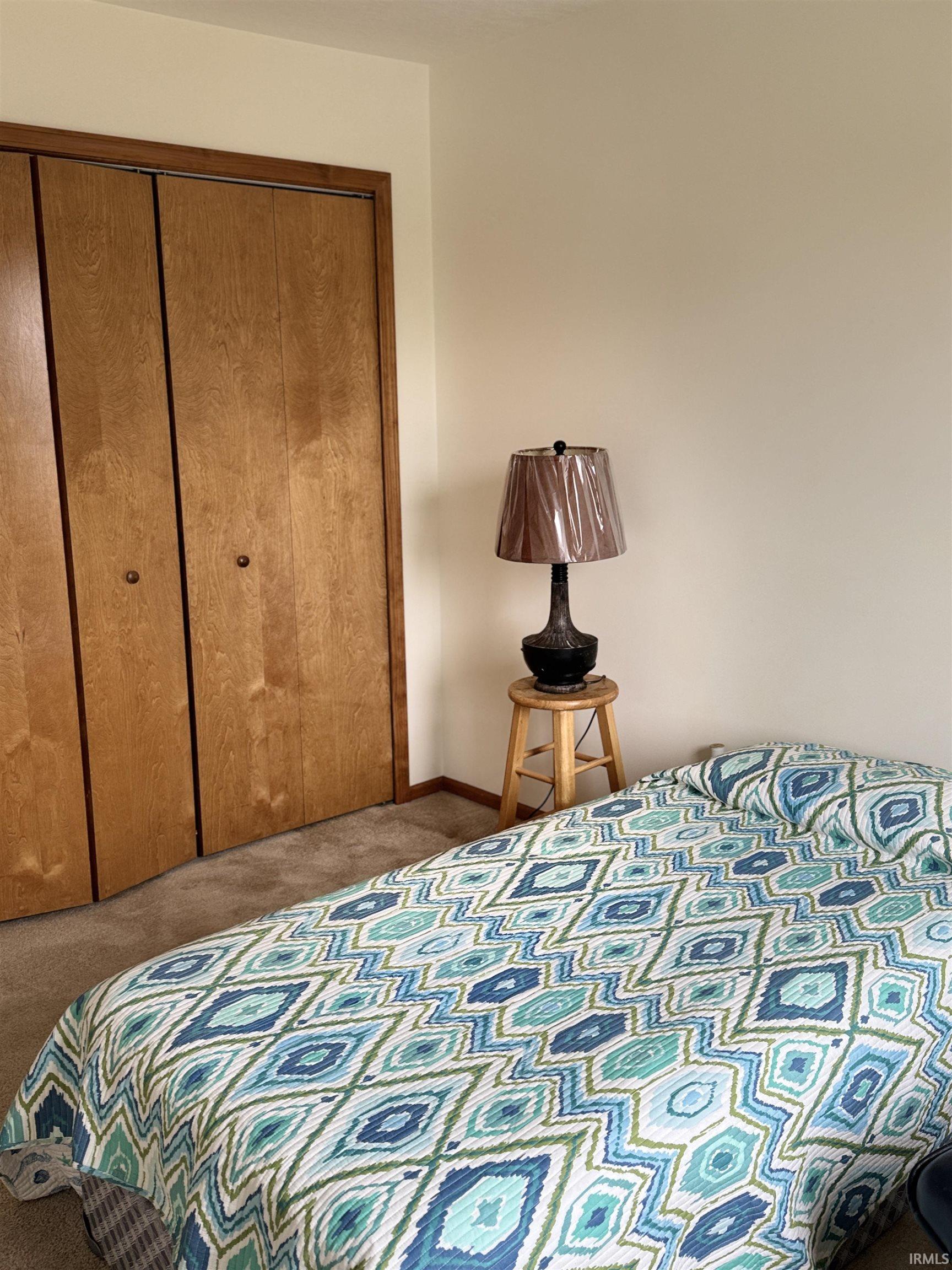 Bedroom featuring a closet and carpet floors