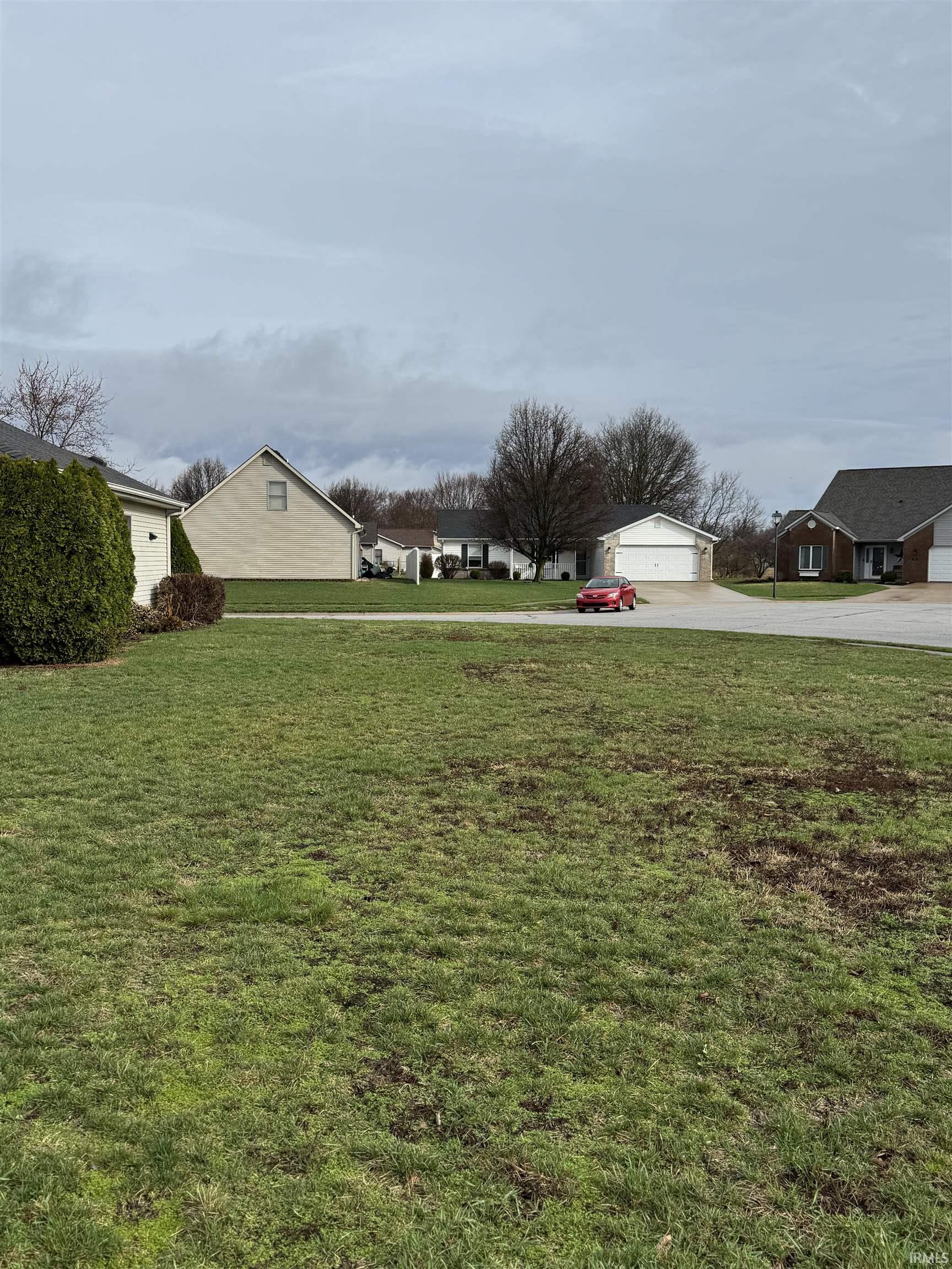 View of green lawn featuring a residential view
