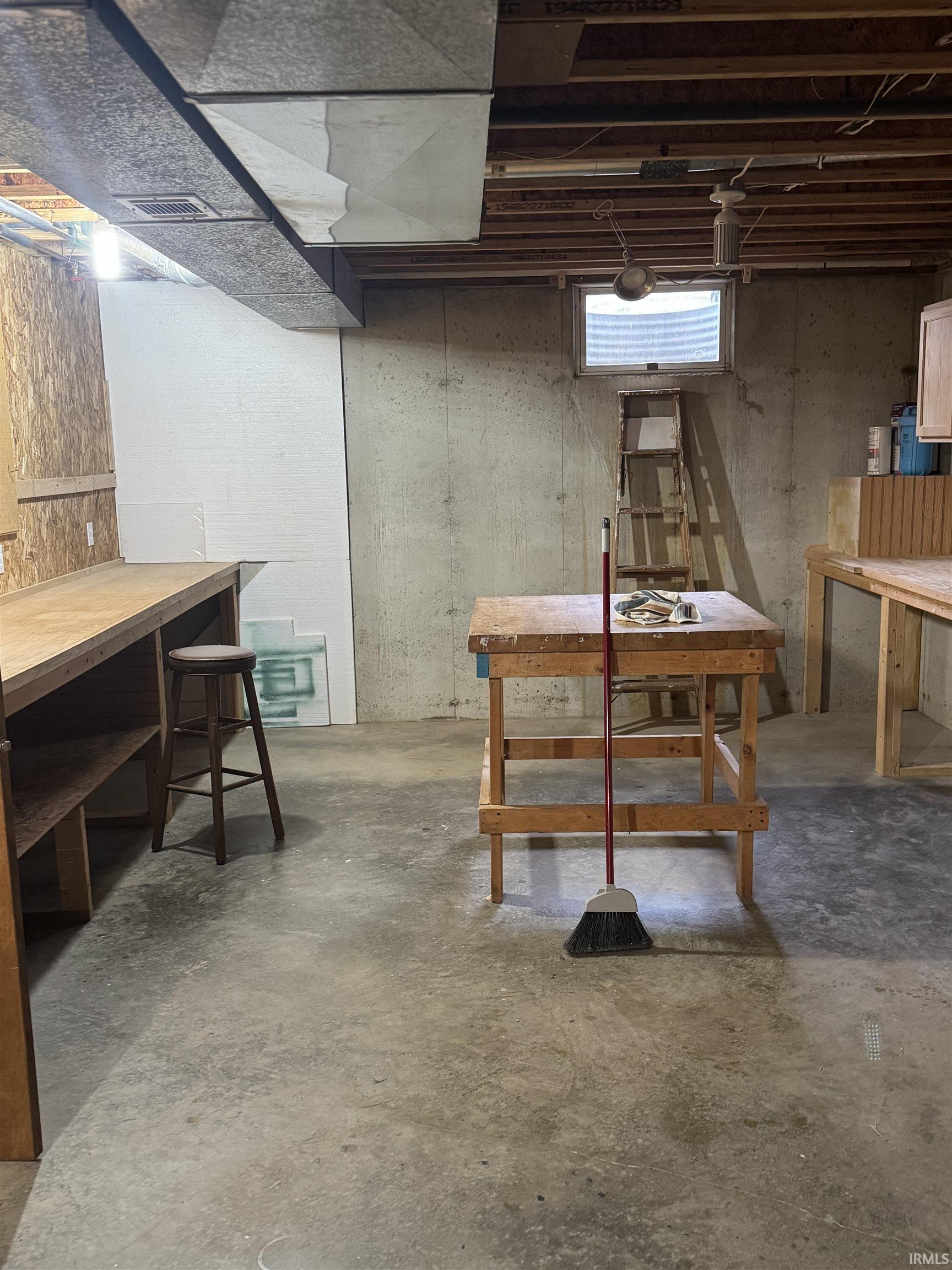 Below grade area with a workshop area