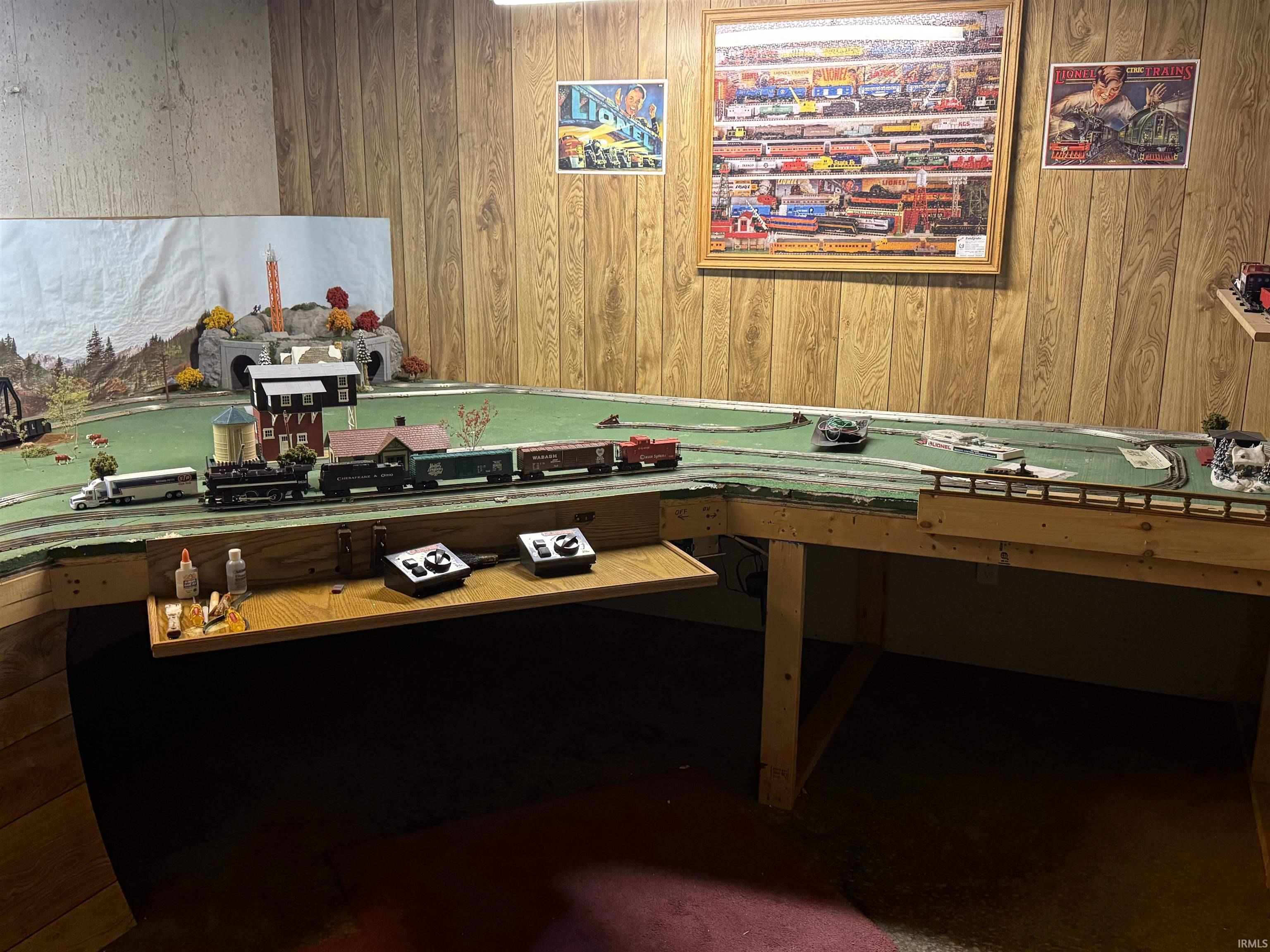 Game room featuring wooden walls