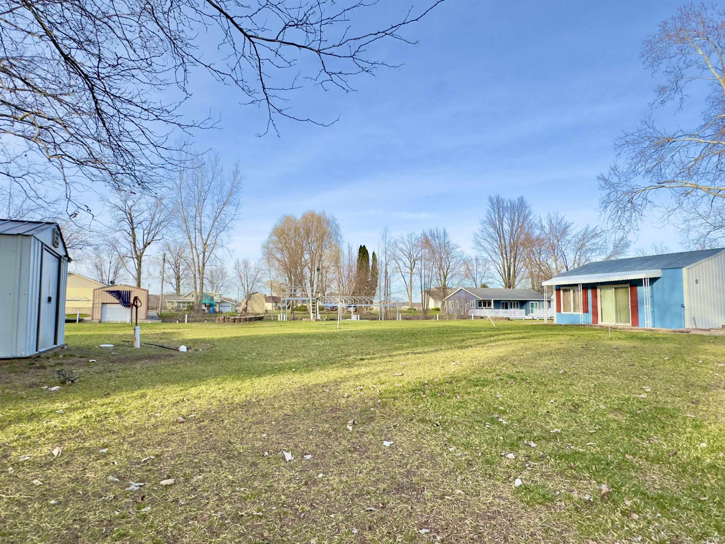 View of green lawn with a shed