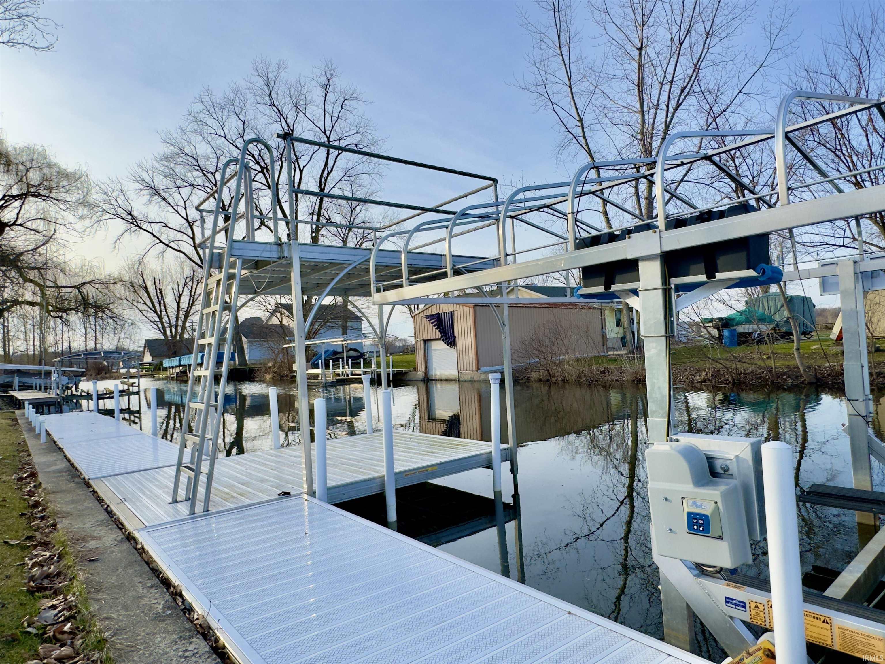 Dock area featuring a water view