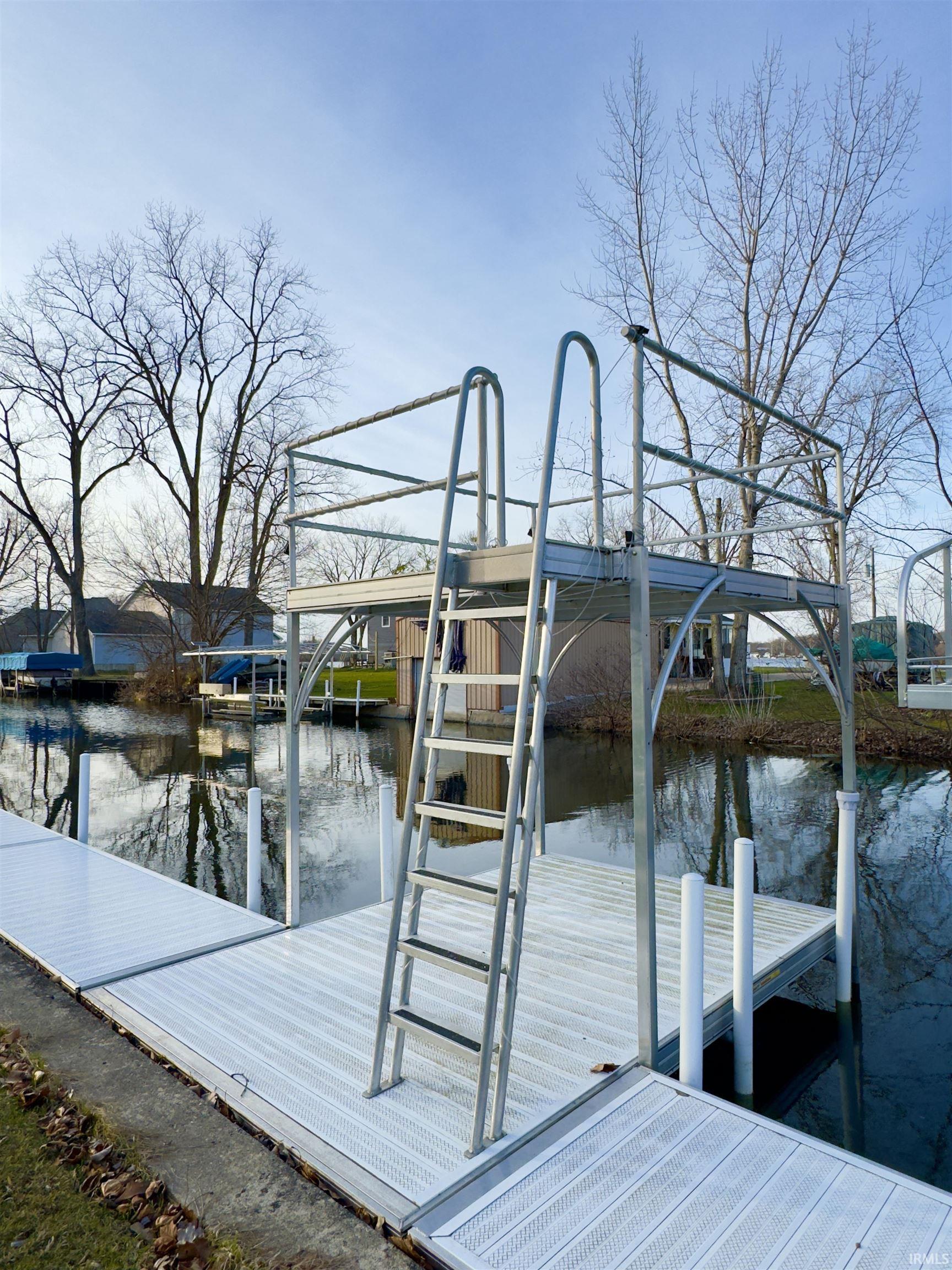 Dock area featuring a water view