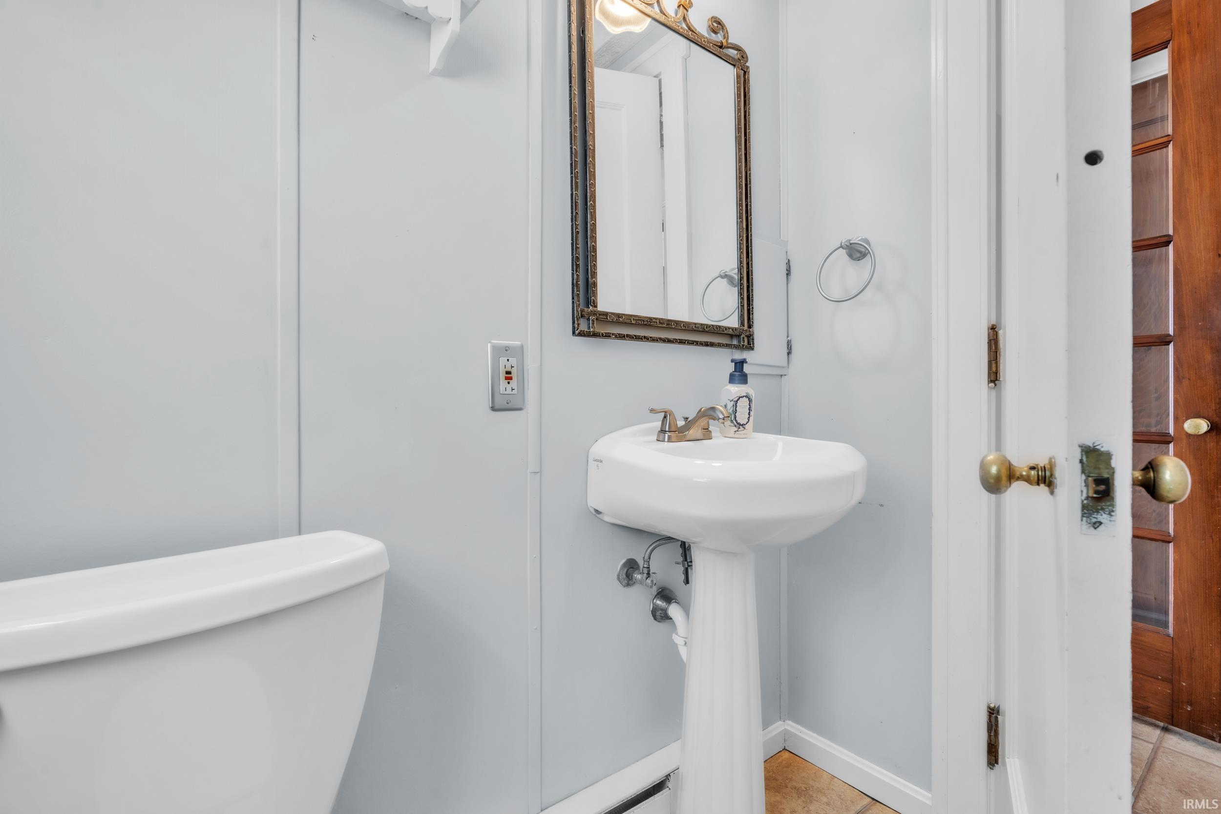 Half bath featuring toilet