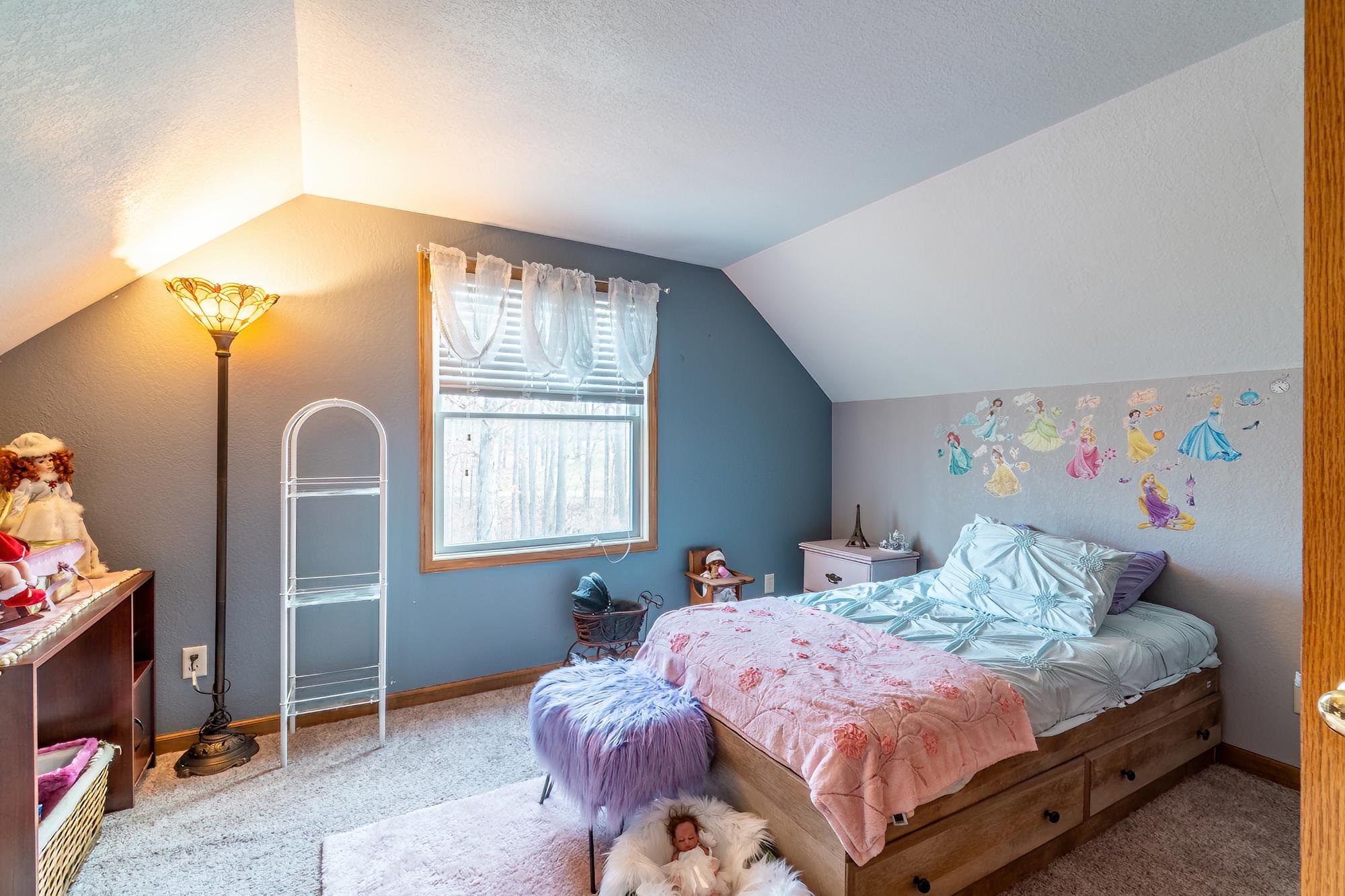 Bedroom with carpet and a textured ceiling