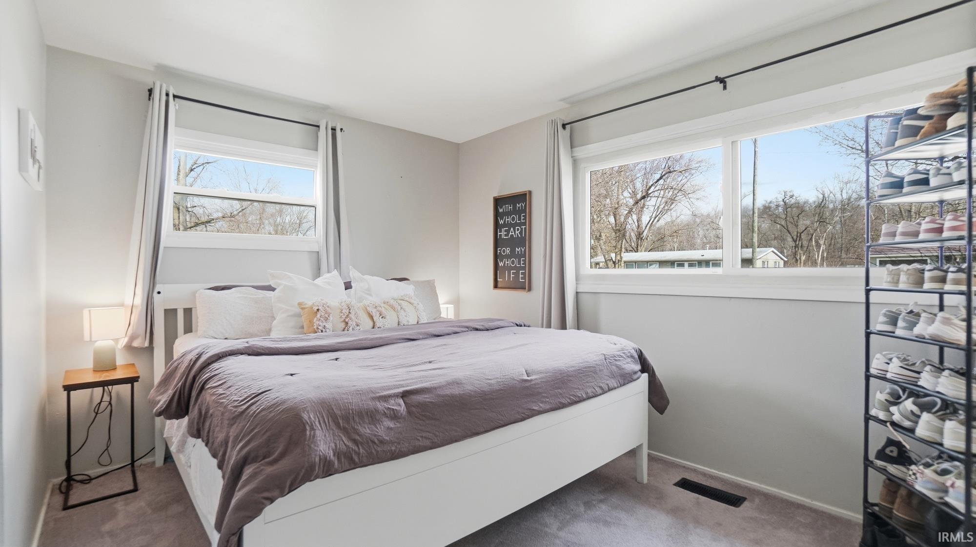 Carpeted bedroom with baseboards