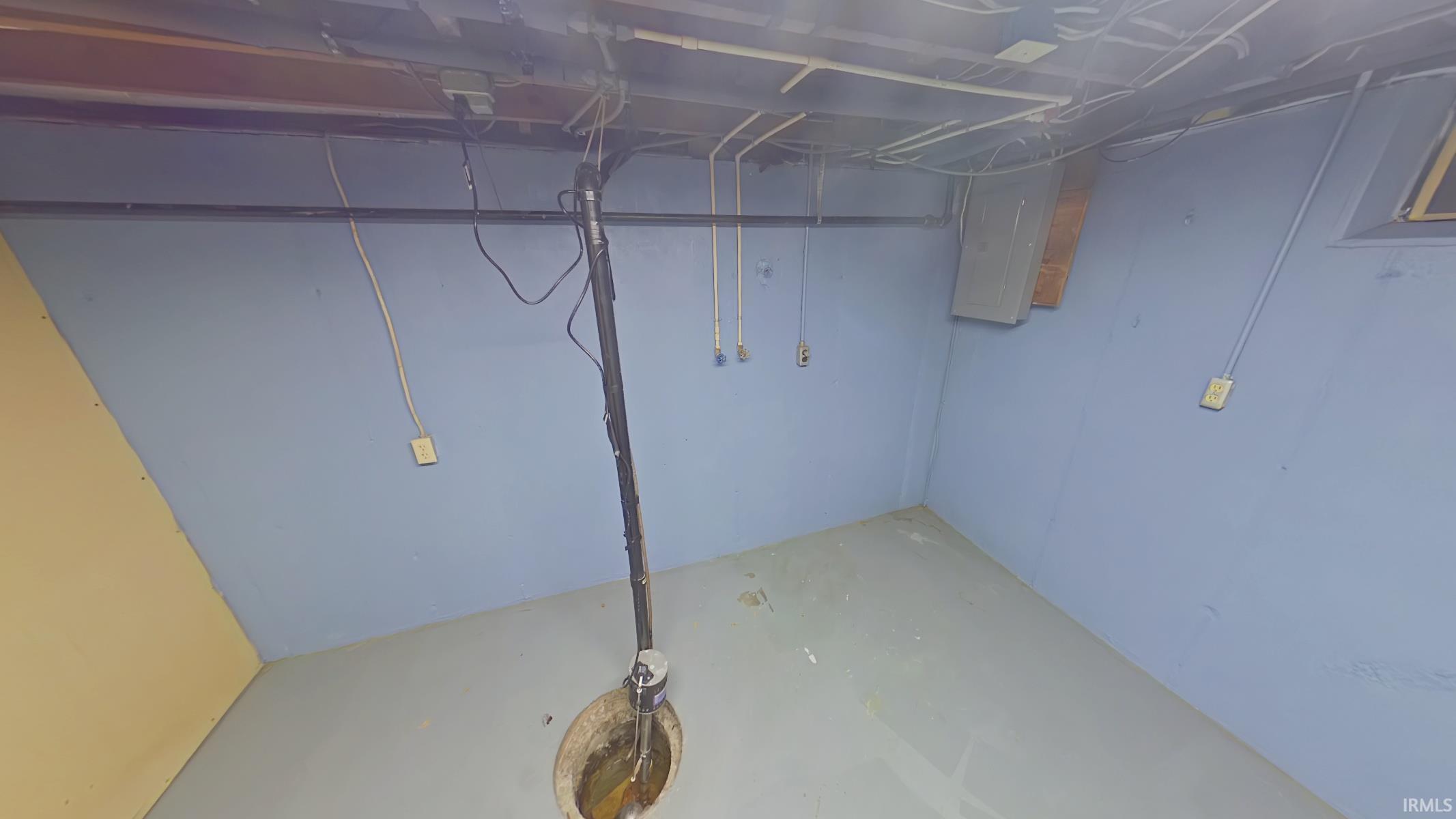 Unfinished basement featuring electric panel