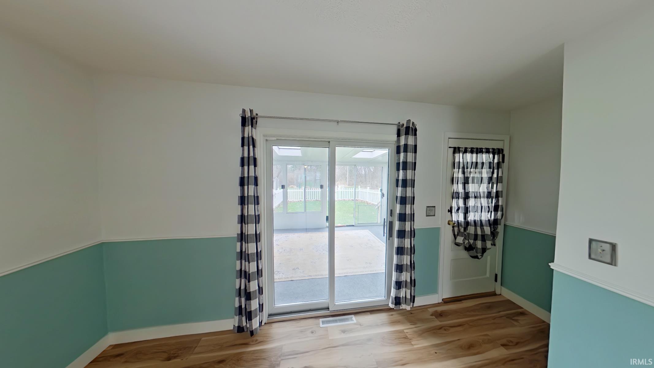 Empty room with light wood-type flooring