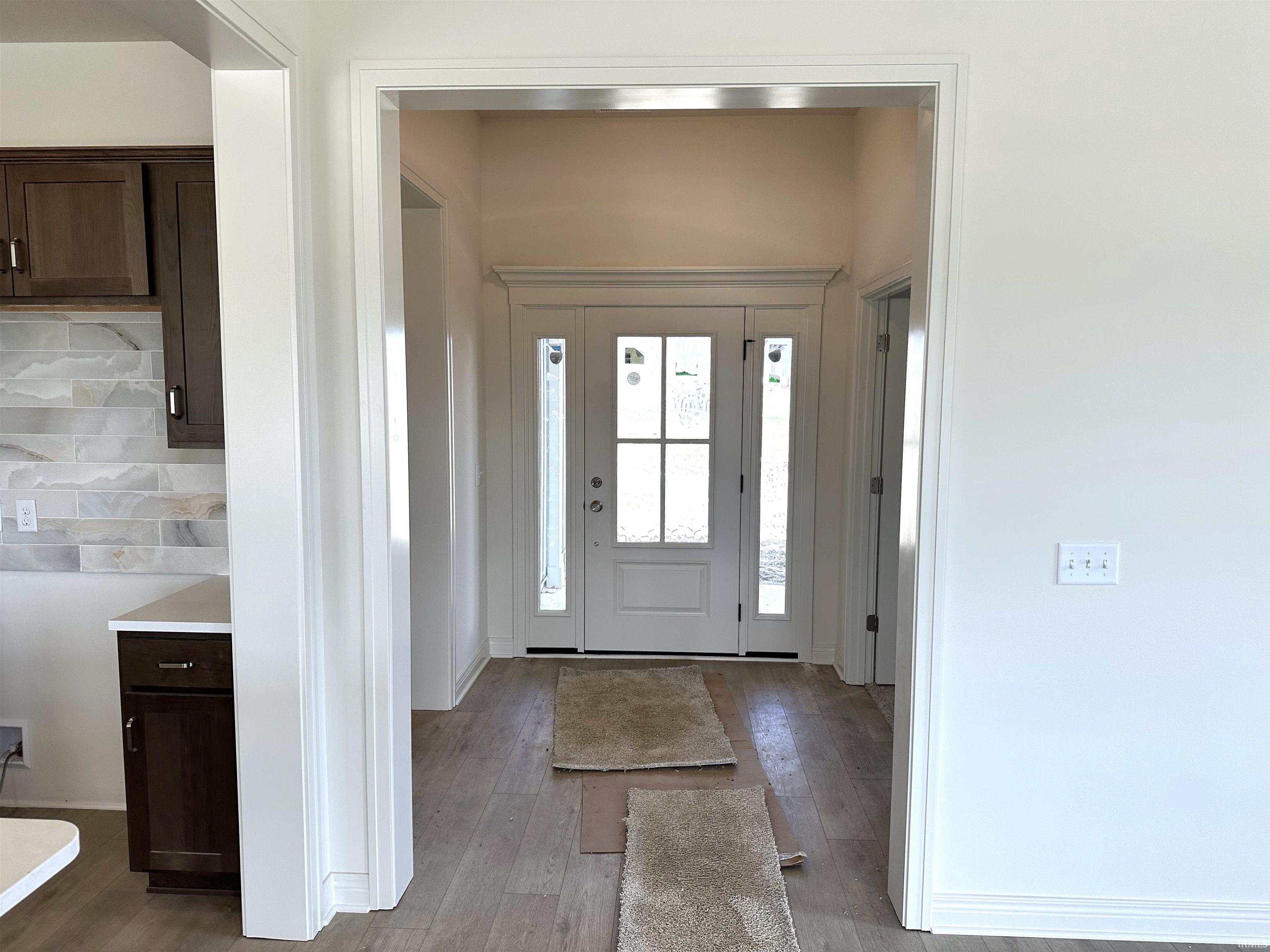 Foyer with light wood-style flooring