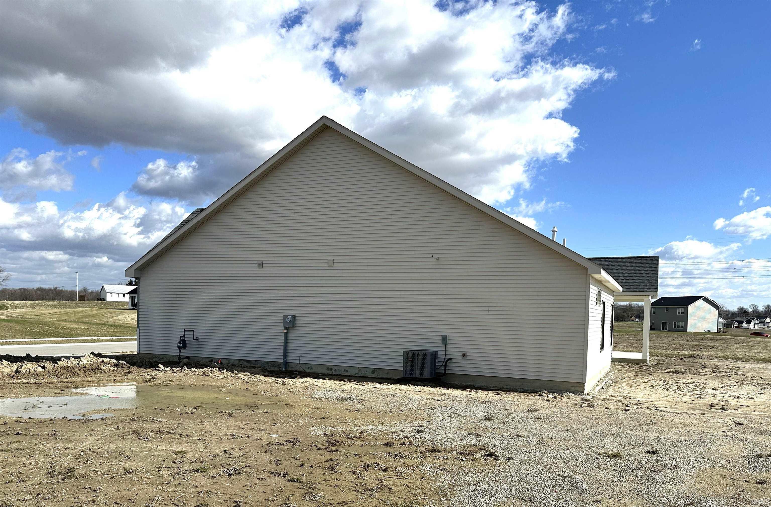 View of property exterior with a central AC unit