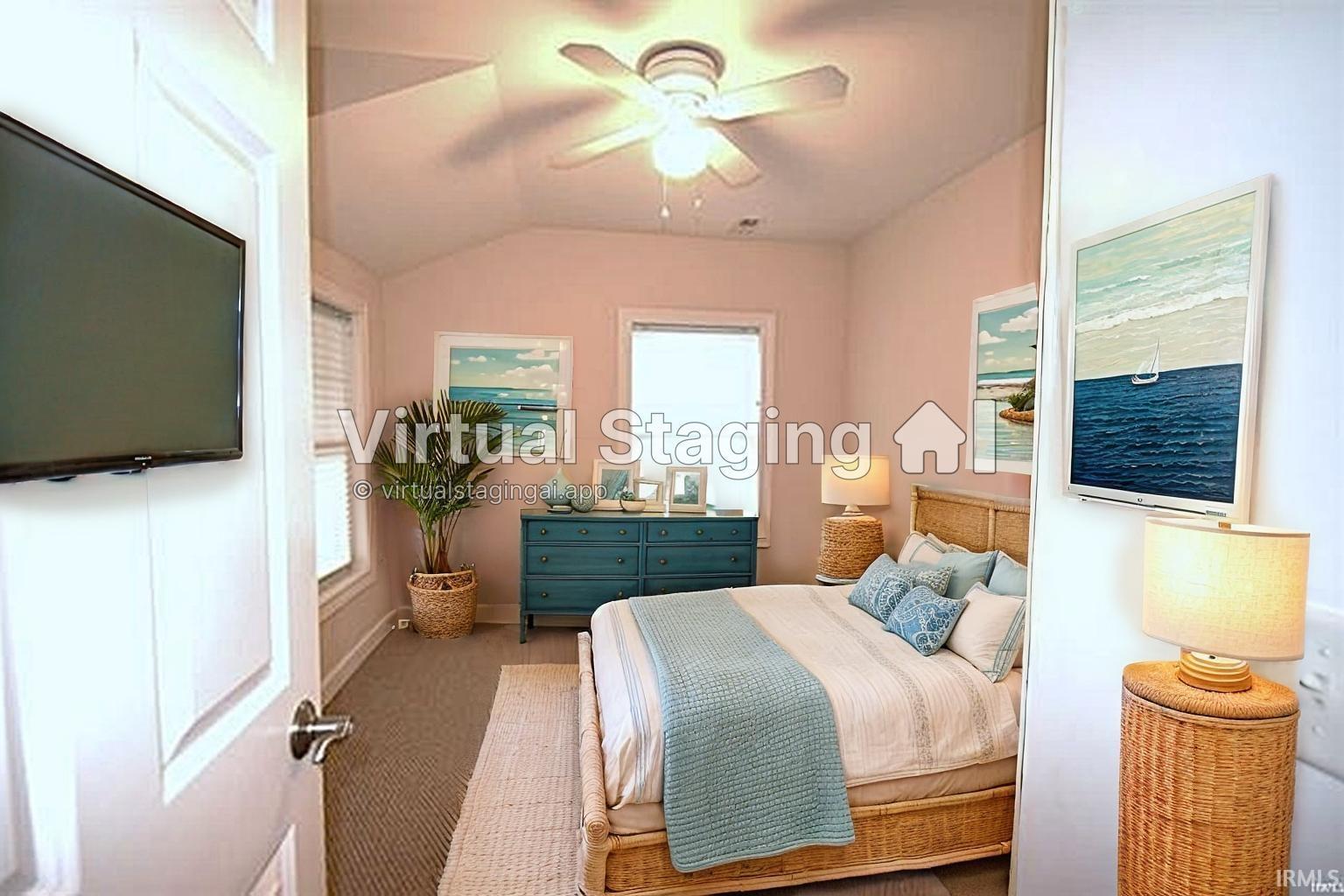 Spacious room featuring a ceiling fan, wall-mounted television, and multiple windows
