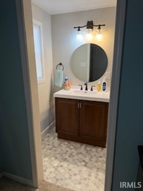 Bathroom featuring wallpapered walls